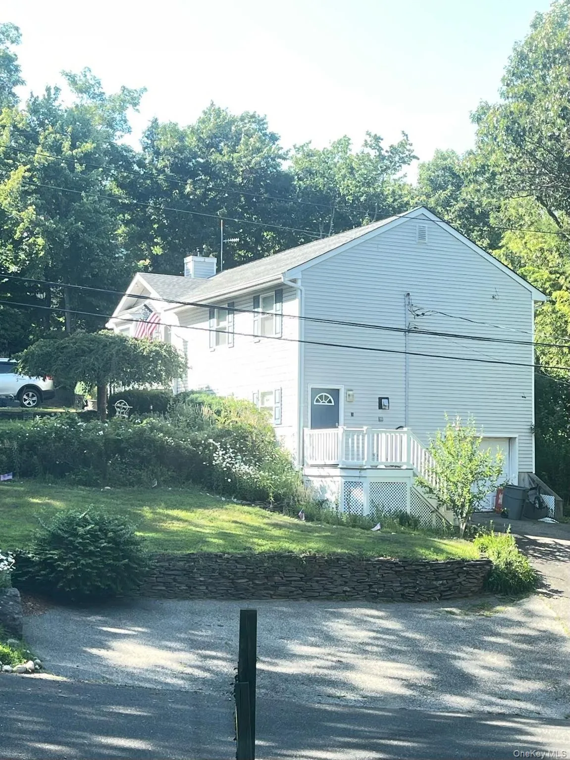 View of home's exterior featuring driveway and a garage View of home's exterior featuring driveway and a garage