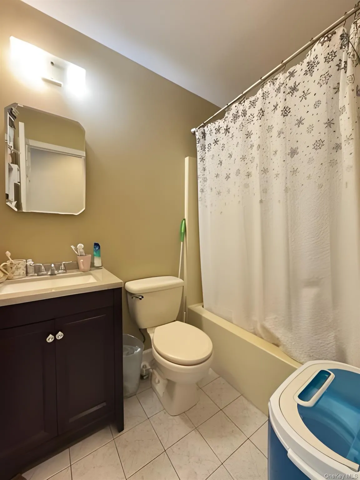 Full bath featuring vanity and shower / tub combo with curtain Full bath featuring vanity and shower / tub combo with curtain