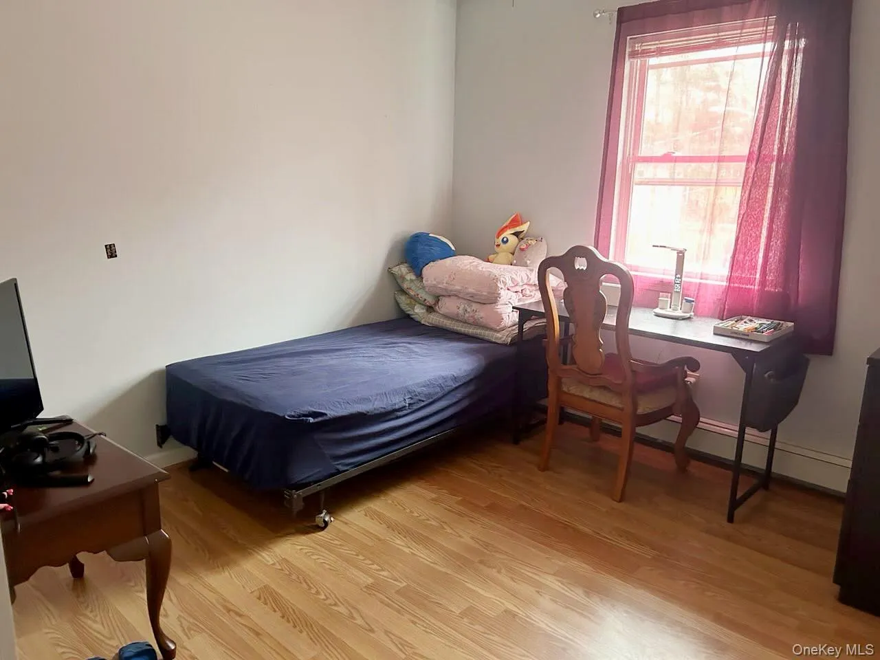 Bedroom featuring light wood-type flooring Bedroom featuring light wood-type flooring