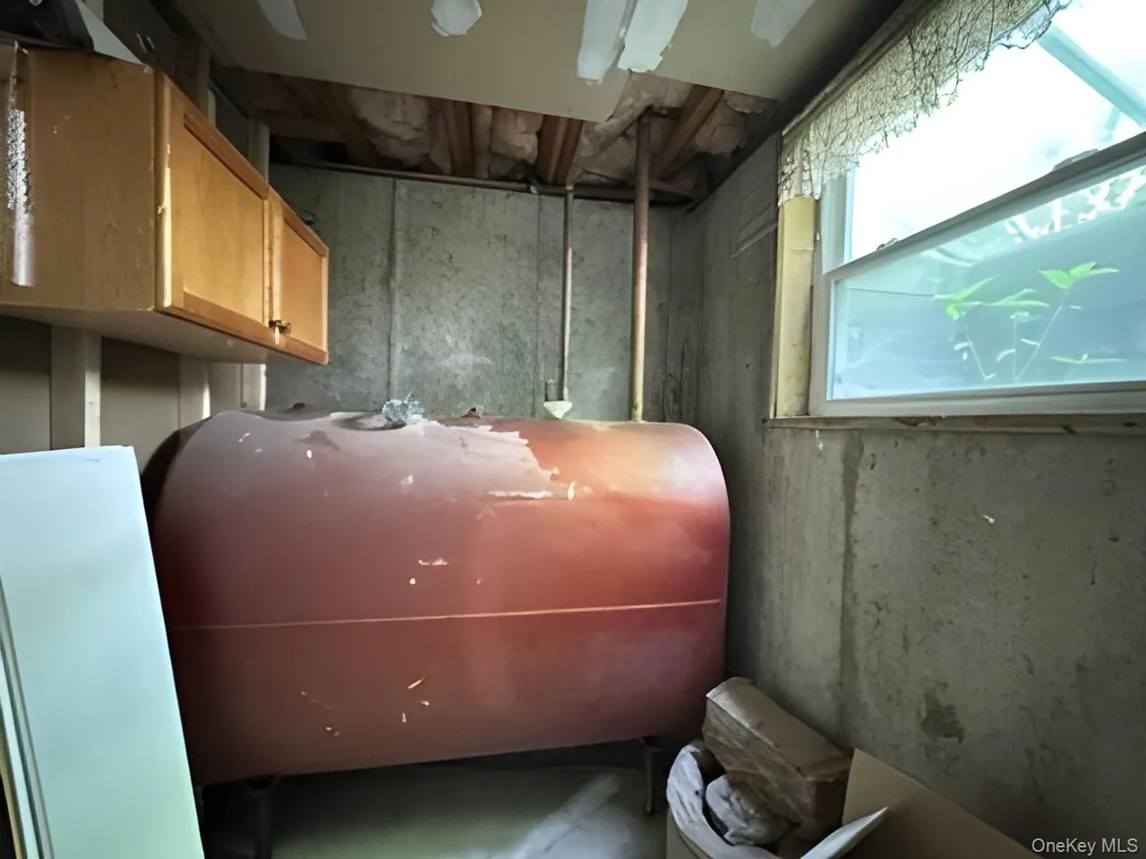 Utility room featuring oil tank Utility room featuring oil tank