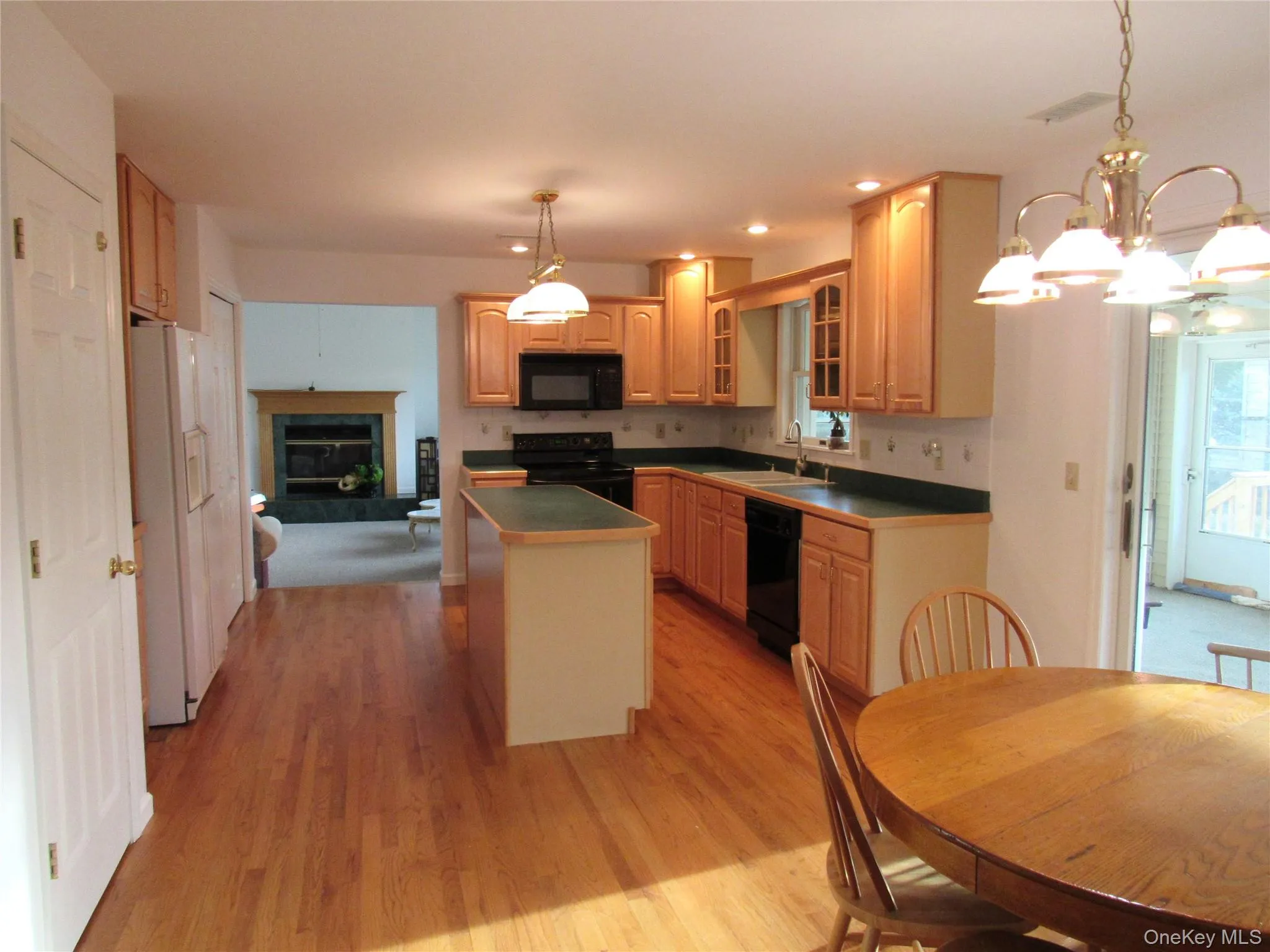 Kitchen leading to Sunroom Kitchen leading to Sunroom