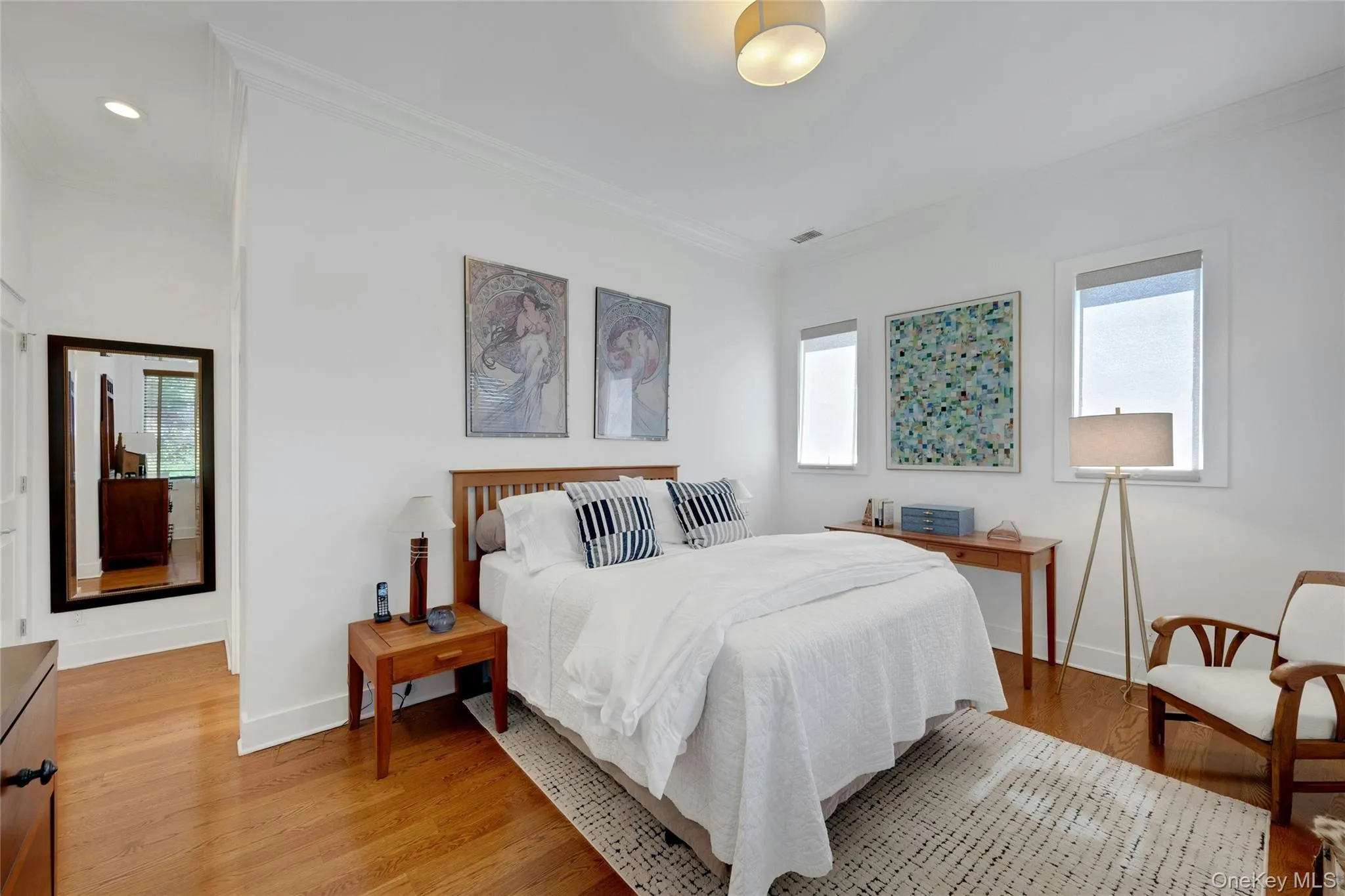 Spacious primary bedroom featuring a walk-in closet and 2nd custom closet. Hardwood floors throughout. Spacious primary bedroom featuring a walk-in closet and 2nd custom closet. Hardwood floors throughout.