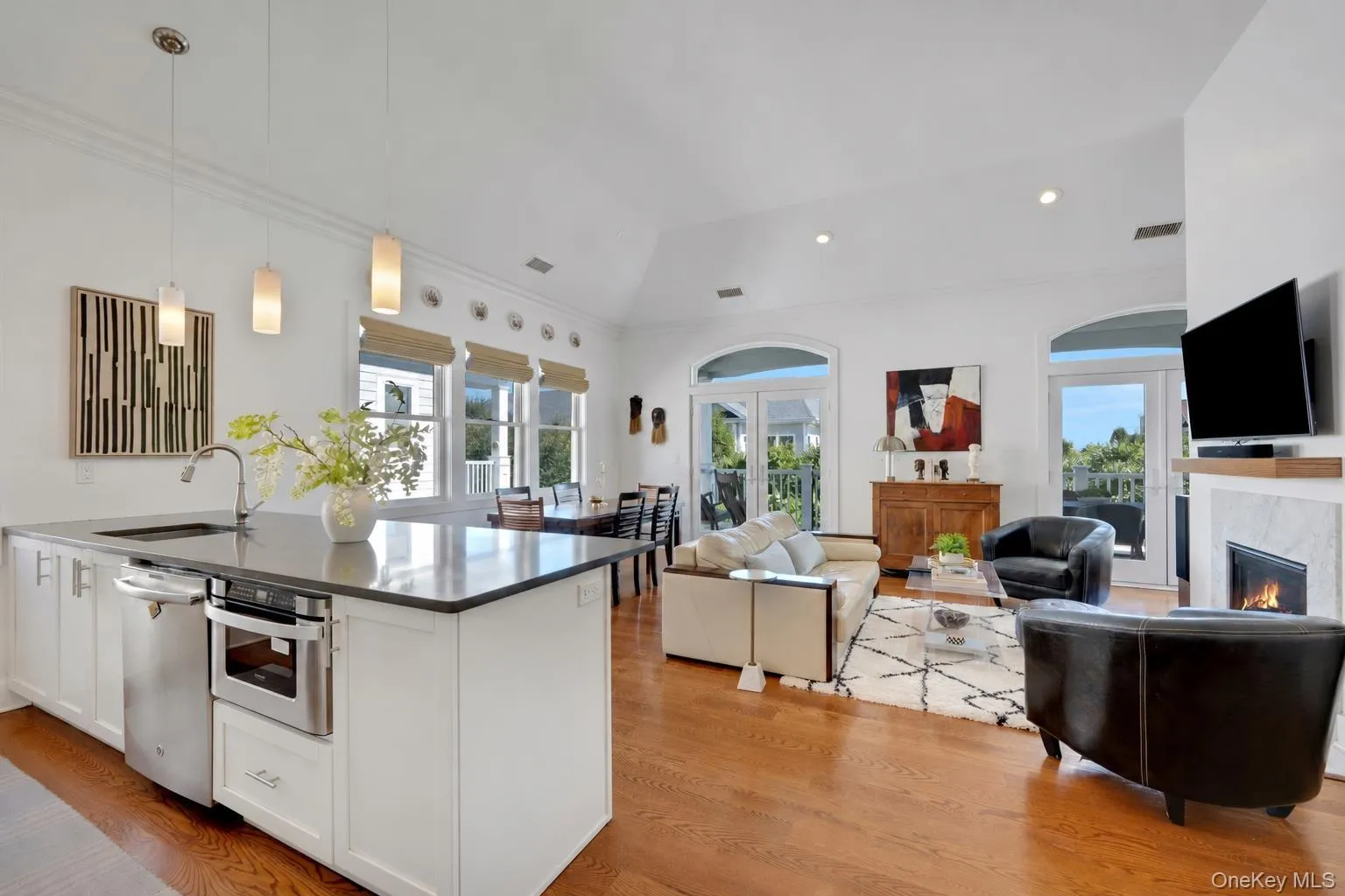 Soaring 15 ft cathedral ceilings and open floor plan. Double French Doors leading outside. Soaring 15 ft cathedral ceilings and open floor plan. Double French Doors leading outside.