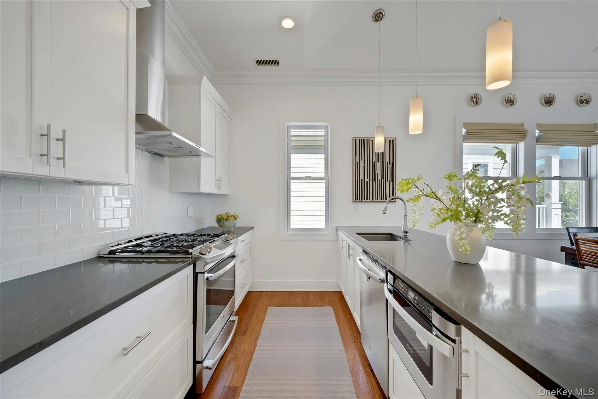 Beautiful Caesarstone island and countertops and hardwood flooring throughout Beautiful Caesarstone island and countertops and hardwood flooring throughout