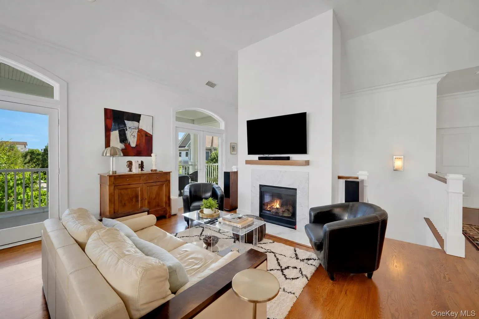 Large living area with double french doors leading out to 40 ft terrace with views of the LI Sound Large living area with double french doors leading out to 40 ft terrace with views of the LI Sound