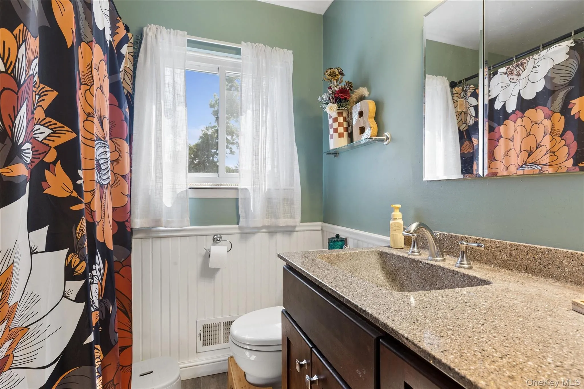 Vanity with integrated sink and stone-look countertop Vanity with integrated sink and stone-look countertop