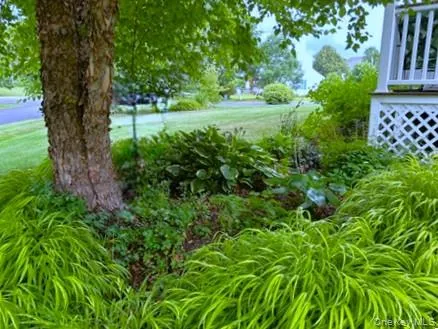 SHADE GARDEN IS ON THE SIDE OF THE FRONT PORCH. SHADE GARDEN IS ON THE SIDE OF THE FRONT PORCH.