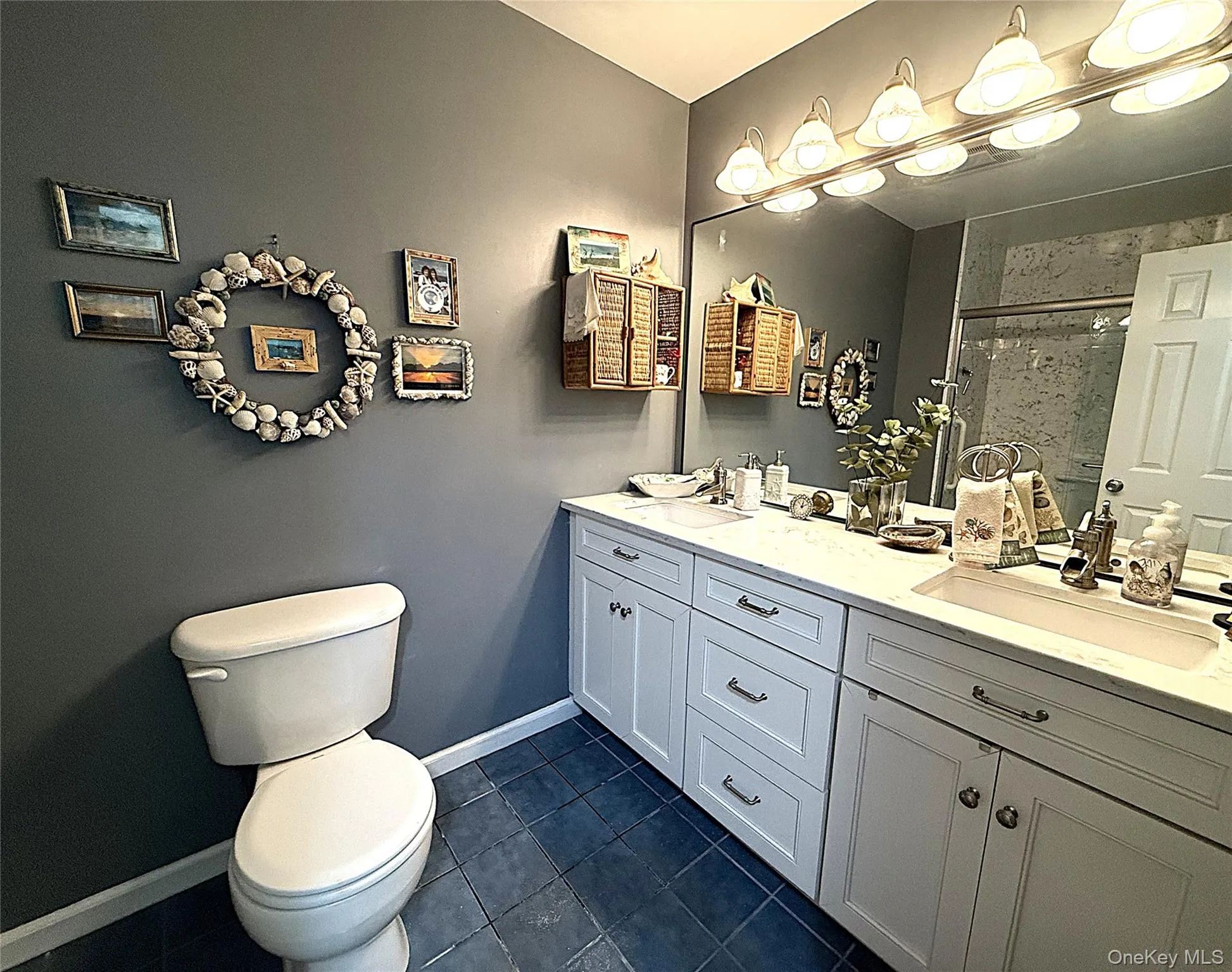 PRIMARY BATH OFFERS A BEAUTIFUL TWO-SINK VANITY AND SHOWER. PRIMARY BATH OFFERS A BEAUTIFUL TWO-SINK VANITY AND SHOWER.