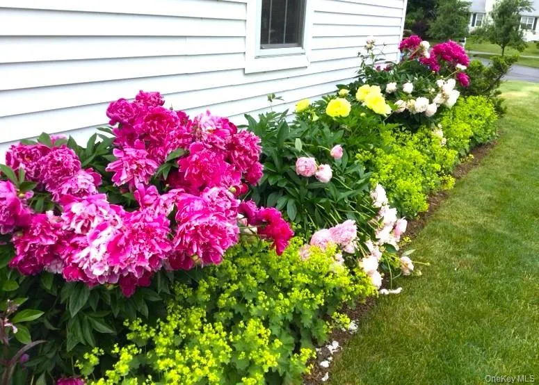 THIS SPECIAL HOME IS SURROUNDED BY PERENNIAL GARDENS. THIS SPECIAL HOME IS SURROUNDED BY PERENNIAL GARDENS.