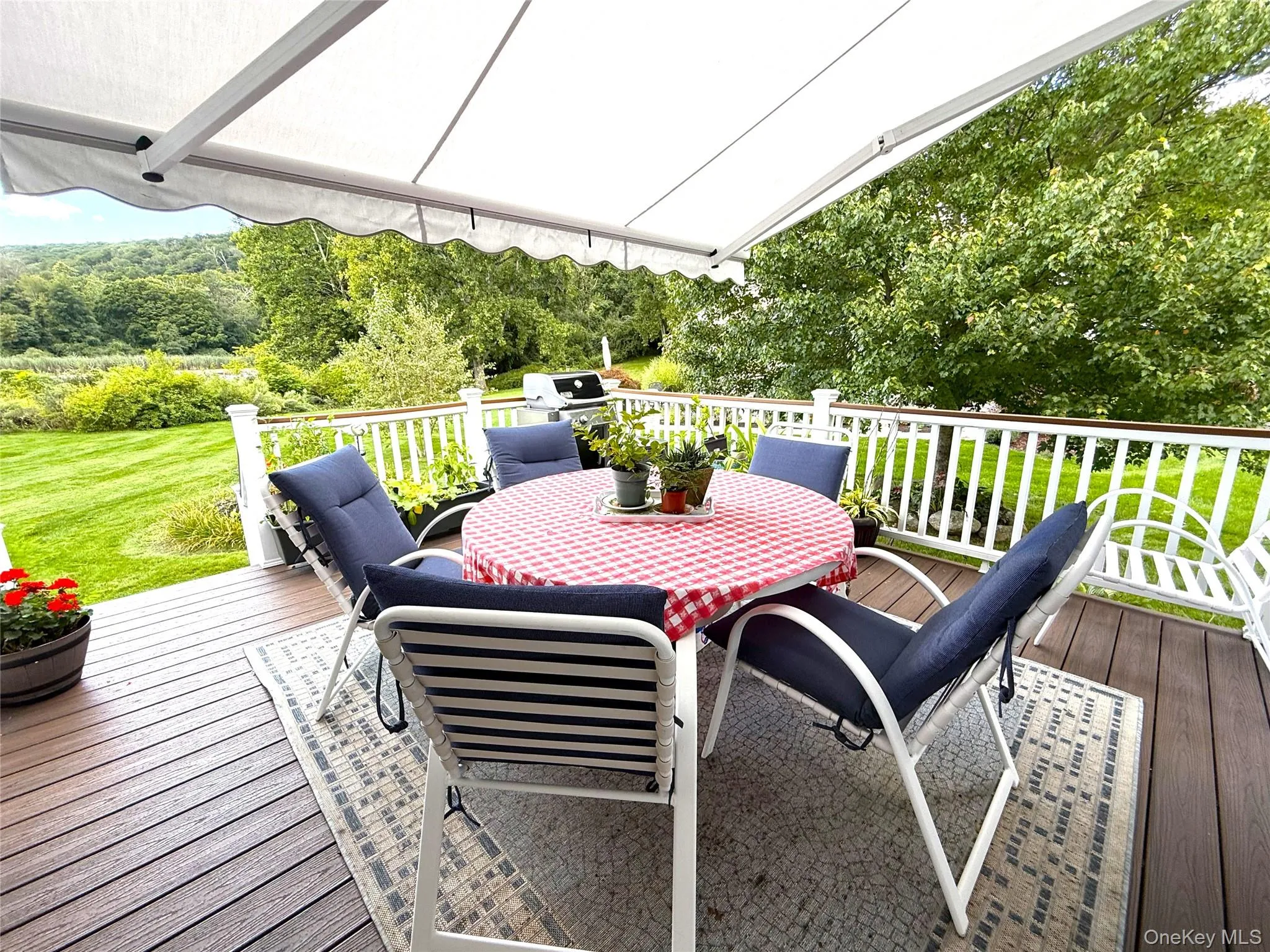 OFF THE FAMILY ROOM IS A GREAT DECK WITH A RETRACTABLE AWNING! THE DECK ENJOYS THE VIEW OF THE SCENIC PROPERTY AND FLOWER GARDENS. OFF THE FAMILY ROOM IS A GREAT DECK WITH A RETRACTABLE AWNING! THE DECK ENJOYS THE VIEW OF THE SCENIC PROPERTY AND FLOWER GARDENS.