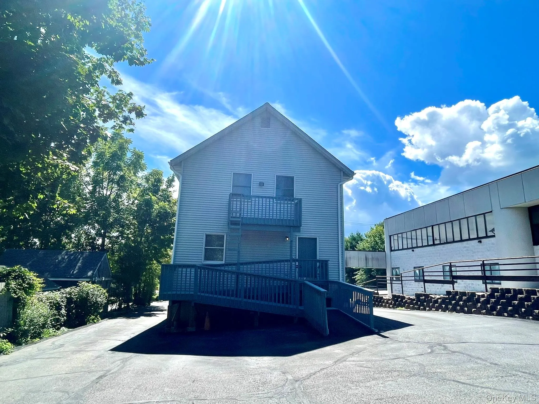 Rear Entrance with Ramp to back door of apt. parking lot for 2 cars Rear Entrance with Ramp to back door of apt. parking lot for 2 cars