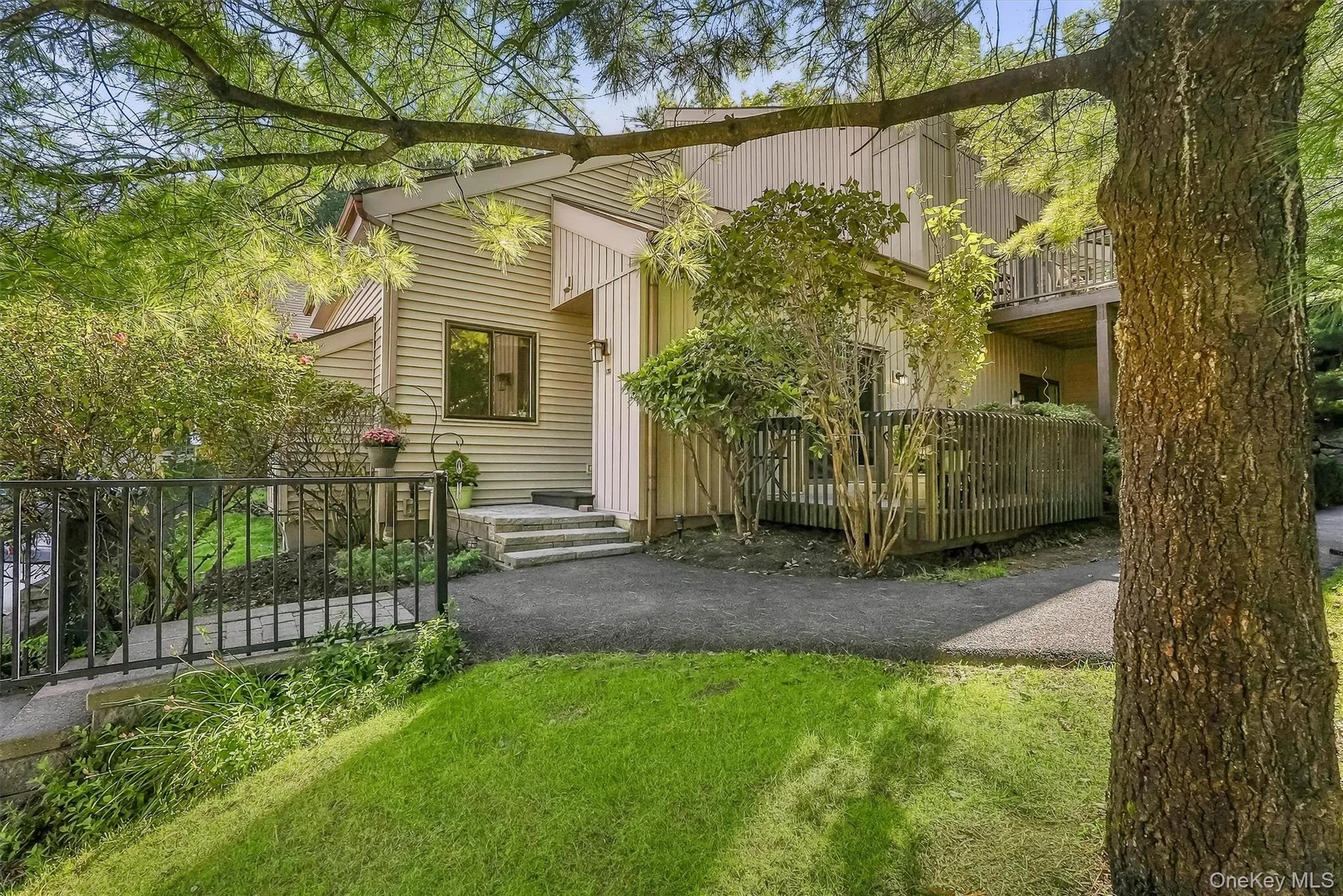 Private first-floor end-unit setting with a tucked-away feel. Private first-floor end-unit setting with a tucked-away feel.