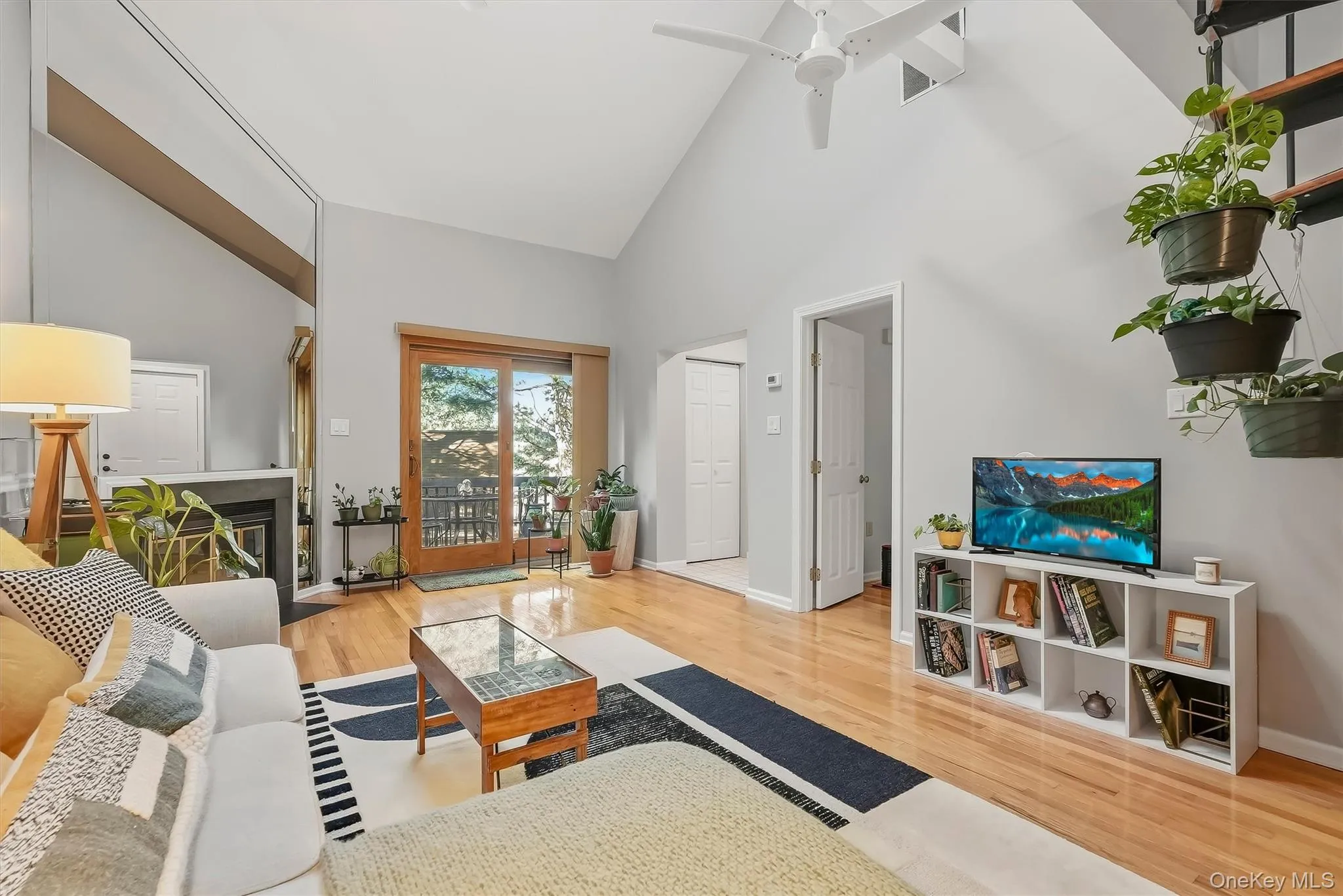 Bright living room opens directly to the private deck for easy indoor-outdoor living. Bright living room opens directly to the private deck for easy indoor-outdoor living.