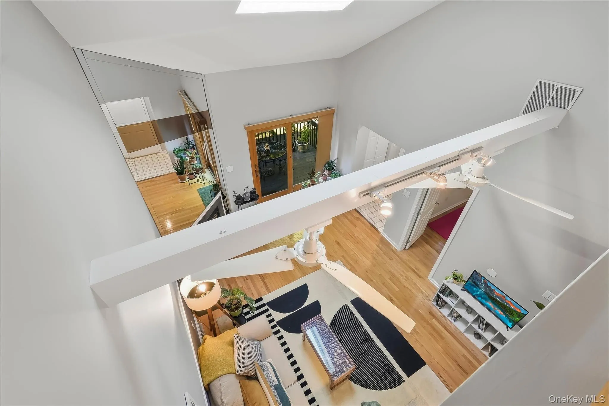 Dramatic loft overlook showcases the open, airy living space below. Dramatic loft overlook showcases the open, airy living space below.