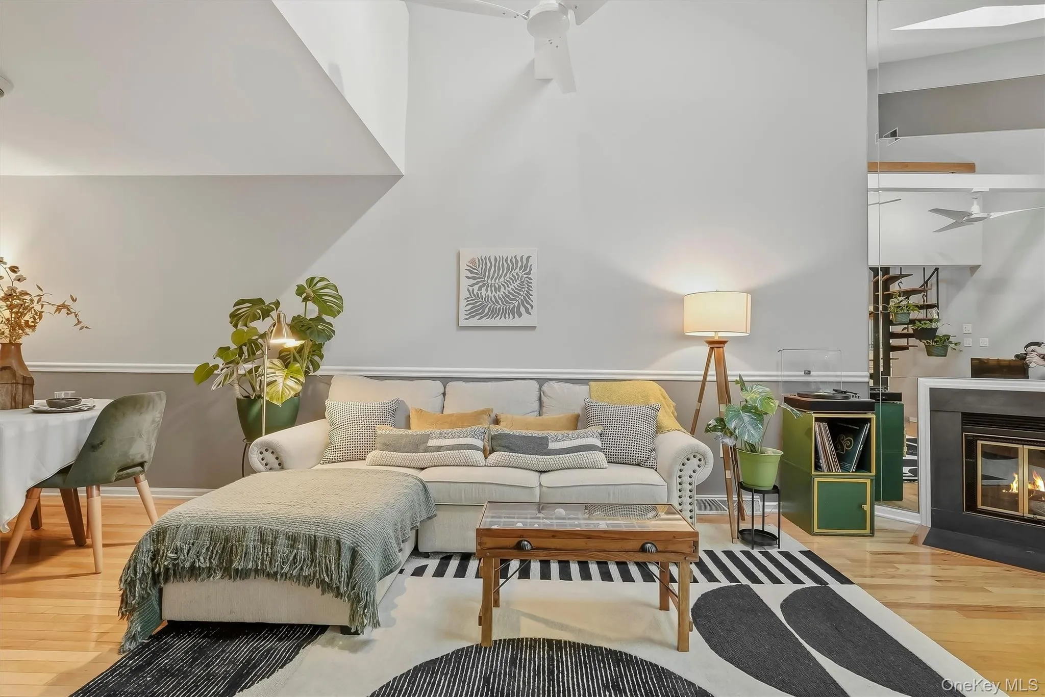 Cozy fireplace anchors the bright, open living area. Cozy fireplace anchors the bright, open living area.