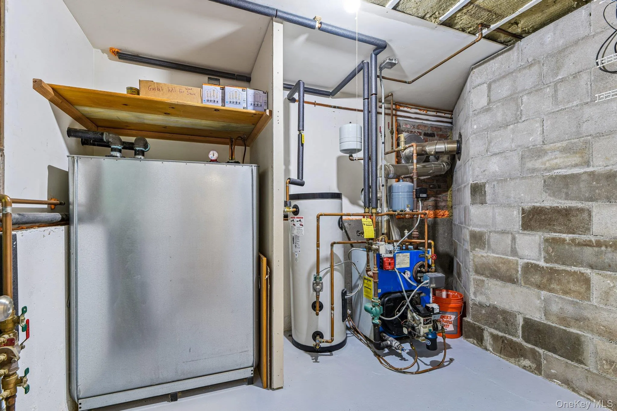 Utility room w/Roth oil tank, burner, hotwater heater, 200 smp electric, and Inground sprinklers controls Utility room w/Roth oil tank, burner, hotwater heater, 200 smp electric, and Inground sprinklers controls