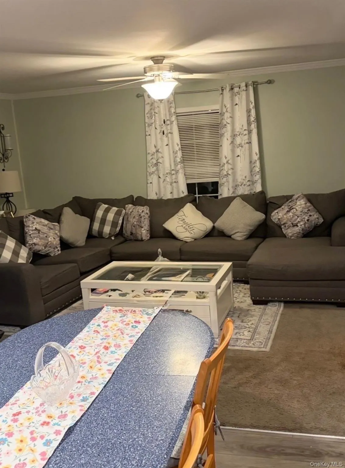 Recessed lighting, crown molding, and a ceiling fan with integrated lighting. Recessed lighting, crown molding, and a ceiling fan with integrated lighting.