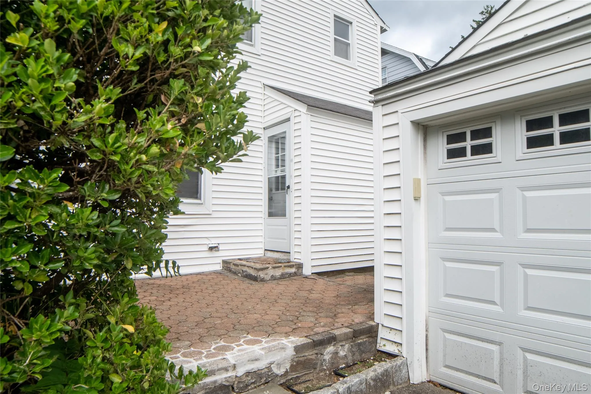 Side Entrance leading to the garage. Side Entrance leading to the garage.
