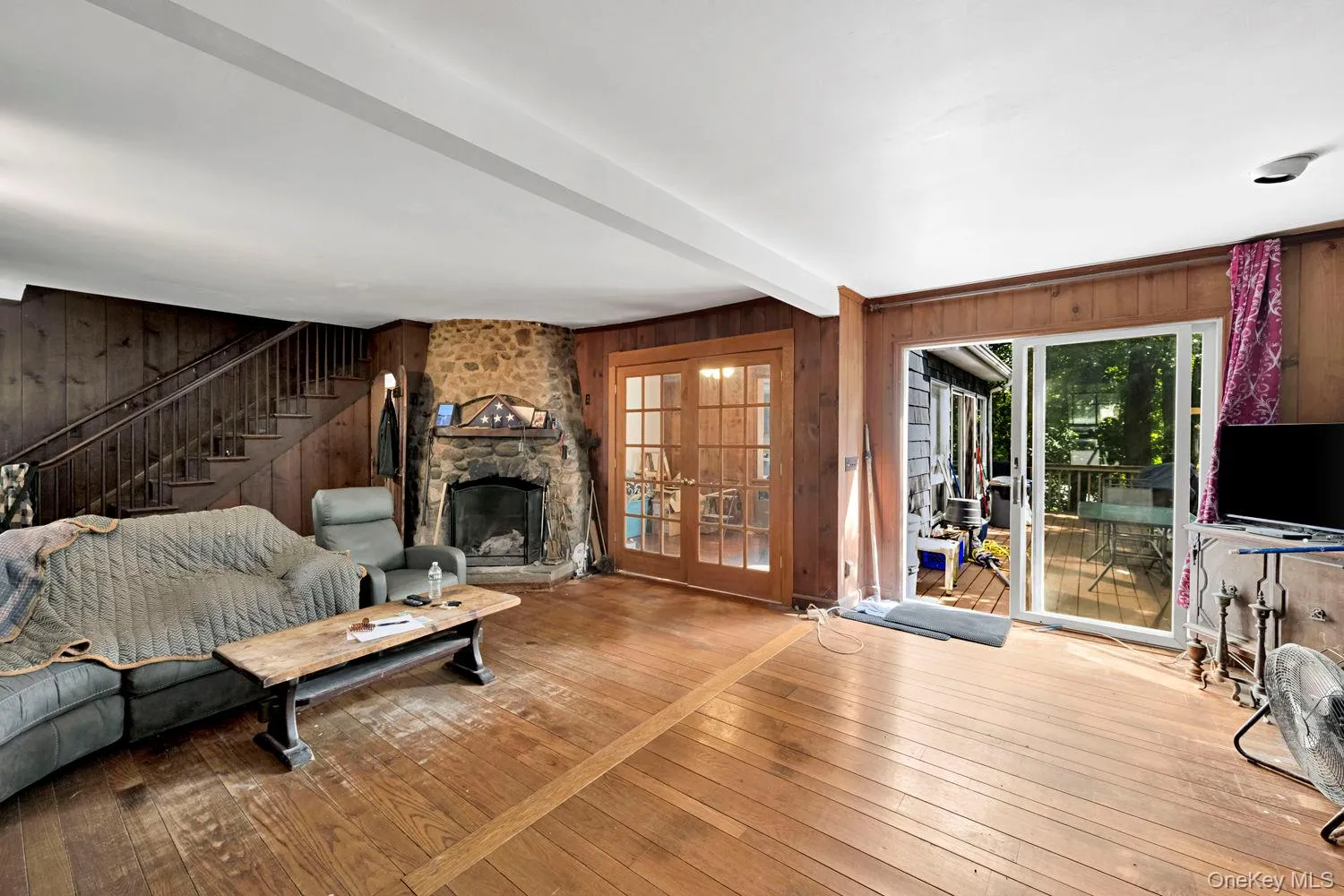 Living room with access to deck. Living room with access to deck.