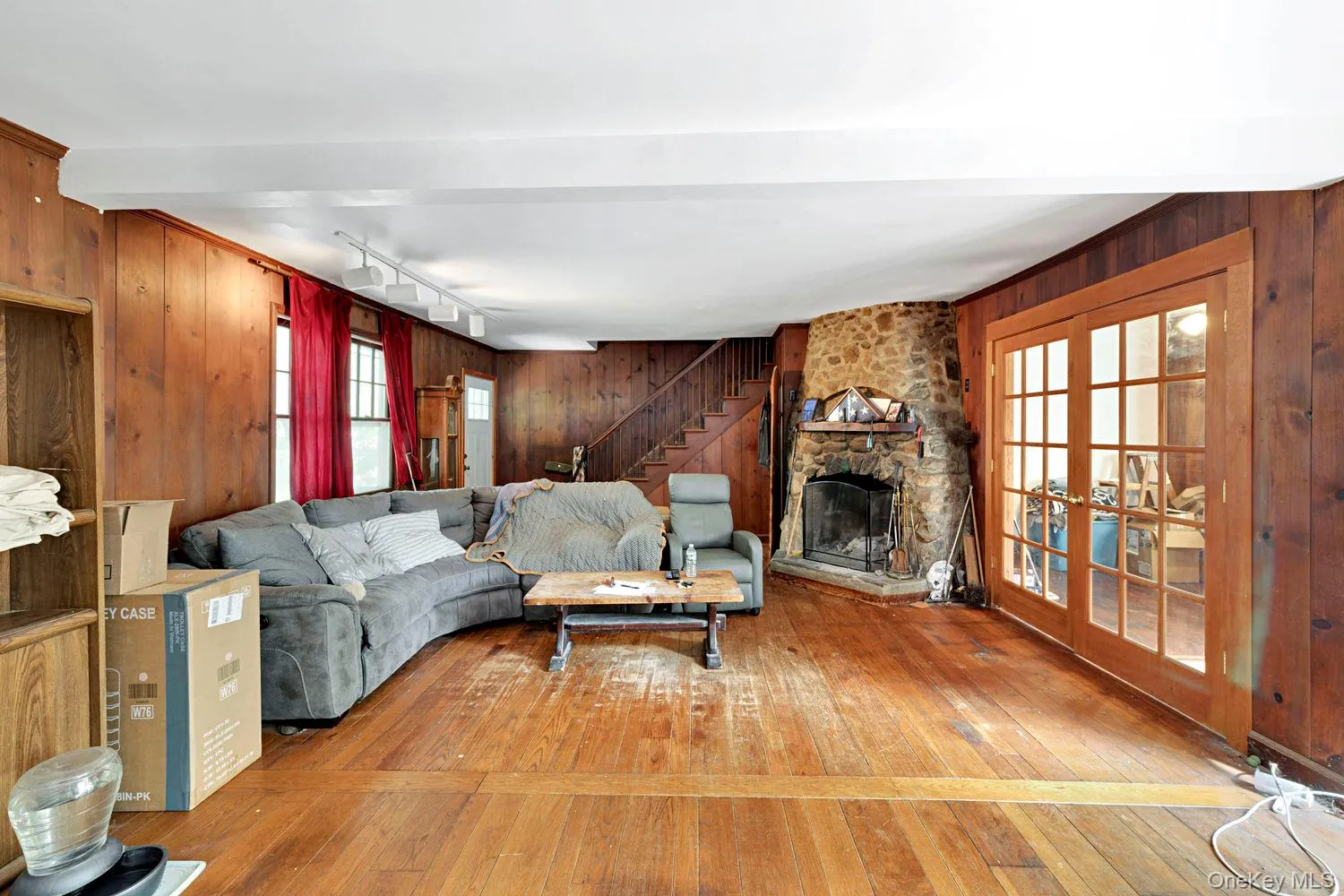 Living room with stone fireplace. Living room with stone fireplace.