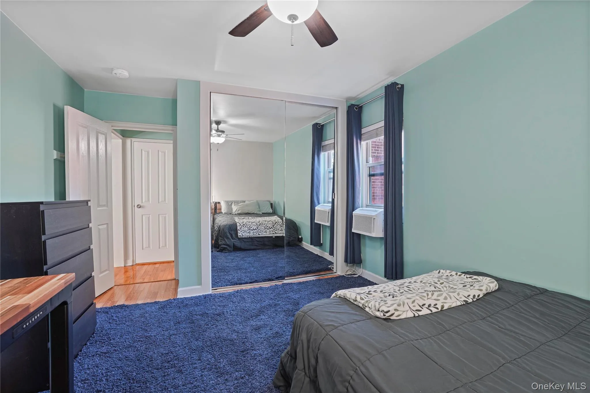 Double width closet offering plenty of storage options. Double width closet offering plenty of storage options.