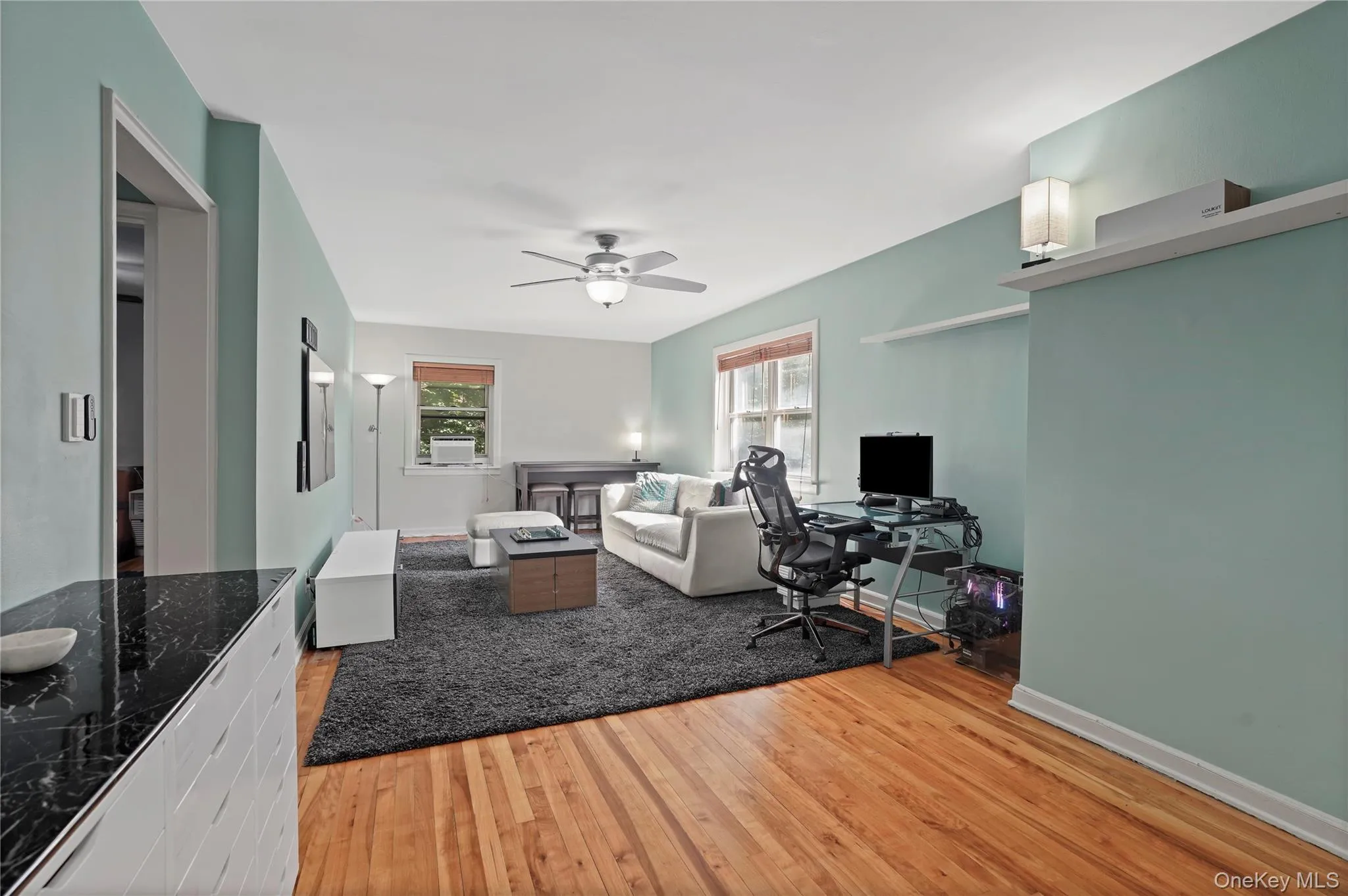 Open floorplan dining/living room with additional area for a home office. Open floorplan dining/living room with additional area for a home office.