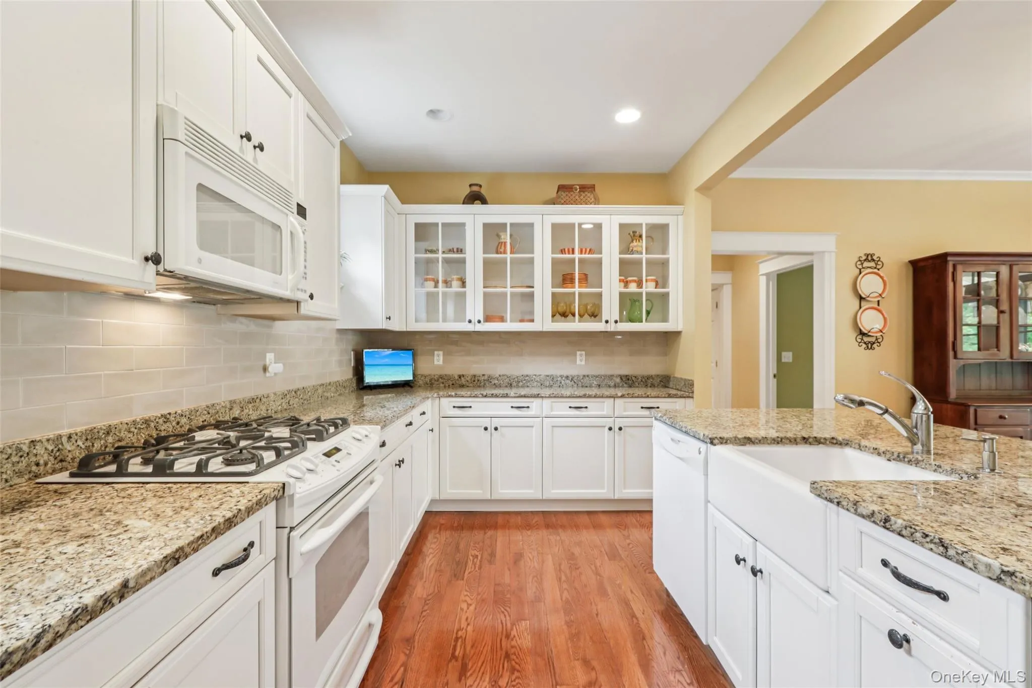Kitchen with a farmhouse sink and granite countertops Kitchen with a farmhouse sink and granite countertops