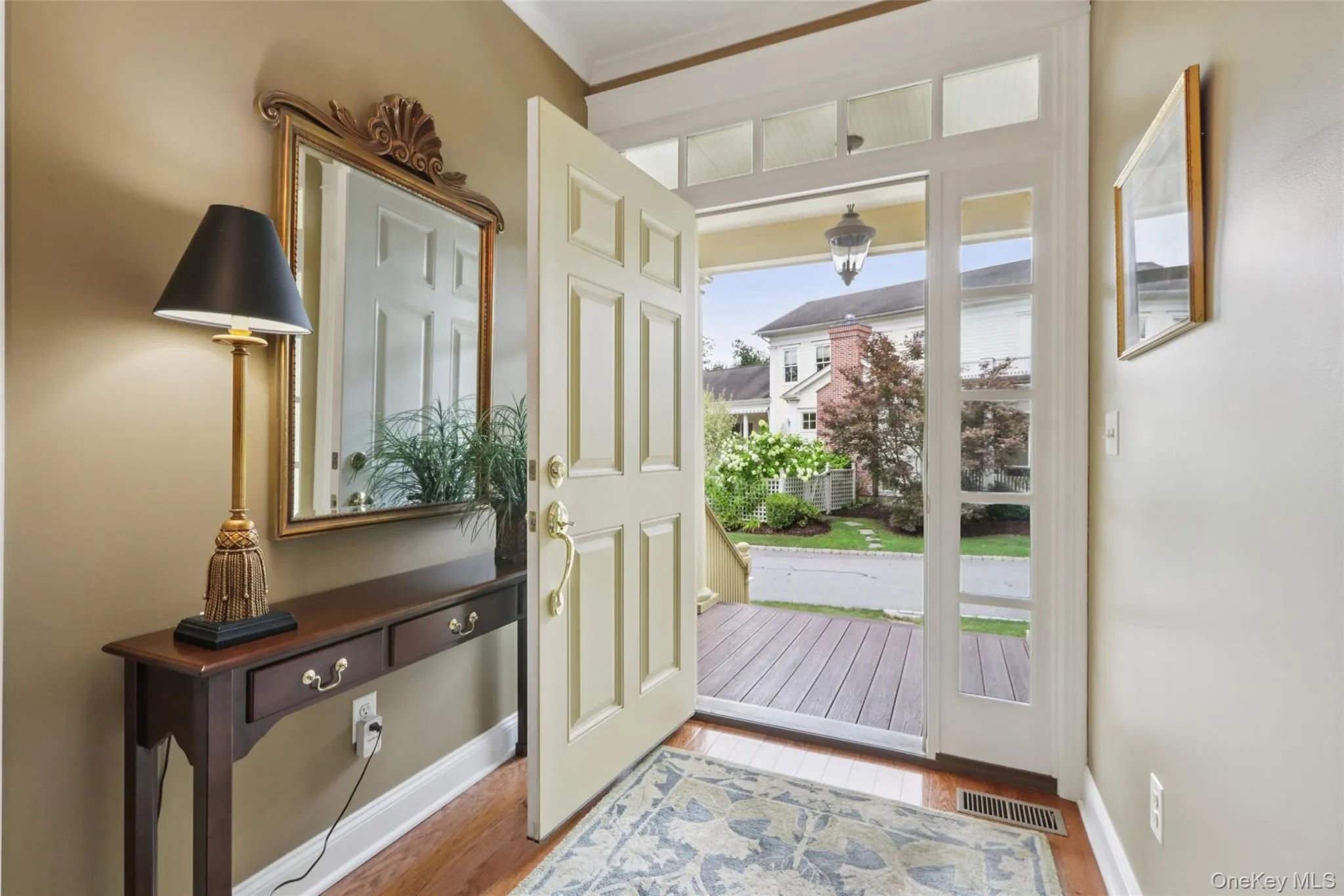 The Foyer welcomes you with high ceilings, crown molding, and hardwood floors The Foyer welcomes you with high ceilings, crown molding, and hardwood floors