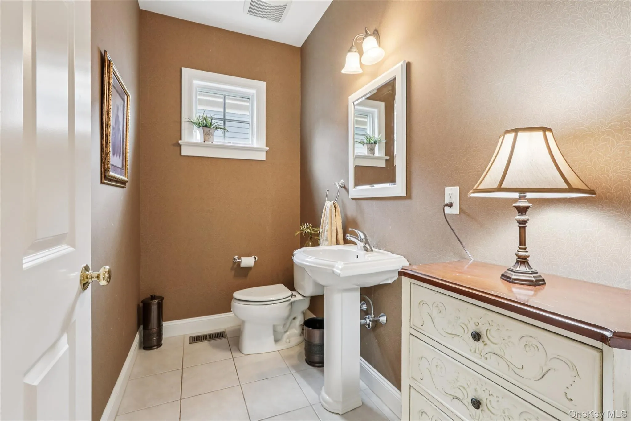 Convenient Powder Room with tile flooring Convenient Powder Room with tile flooring