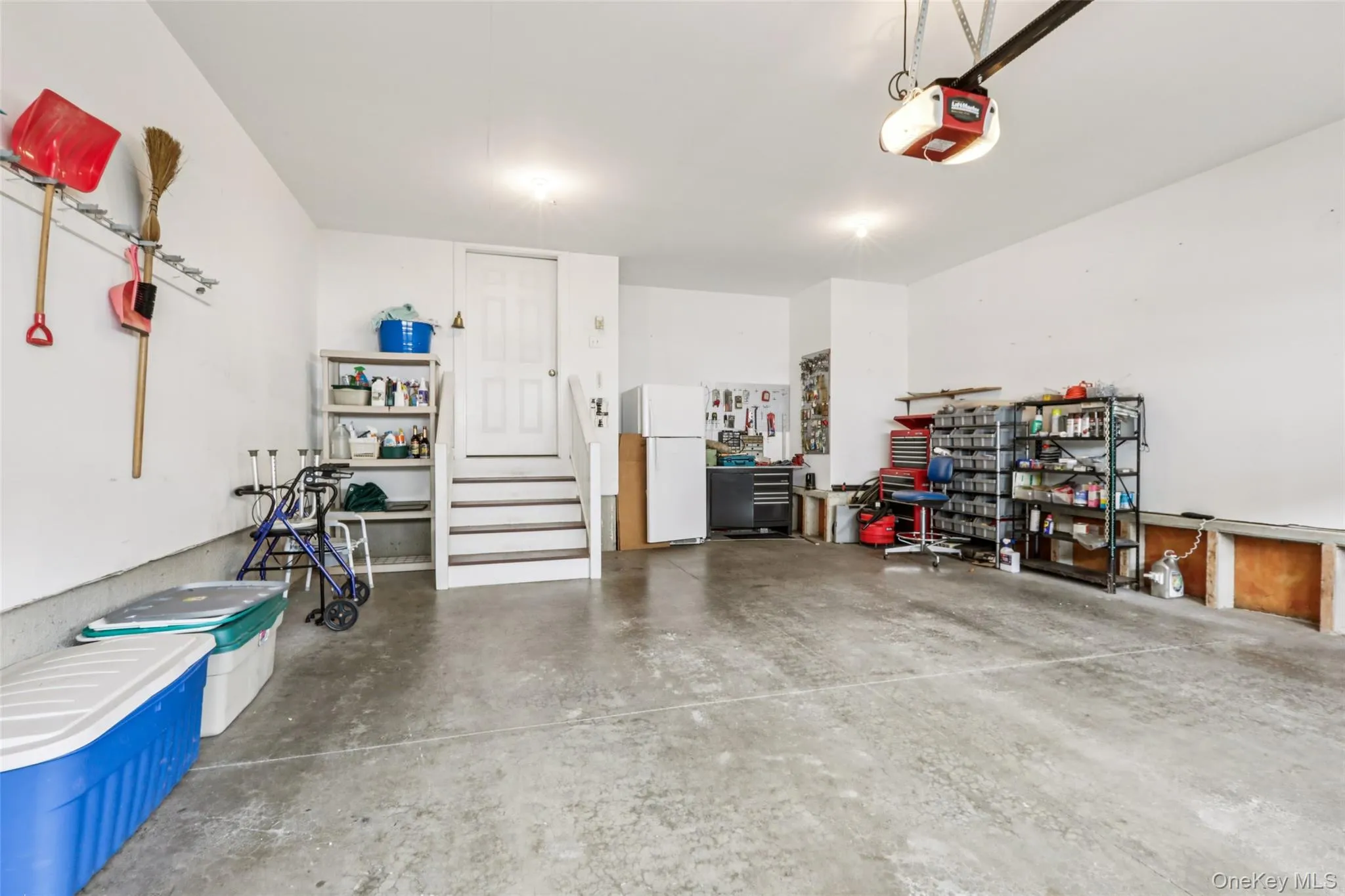 2 Car Garage with a workshop nook in the back right side. Entry into the back hallway. 2 Car Garage with a workshop nook in the back right side. Entry into the back hallway.