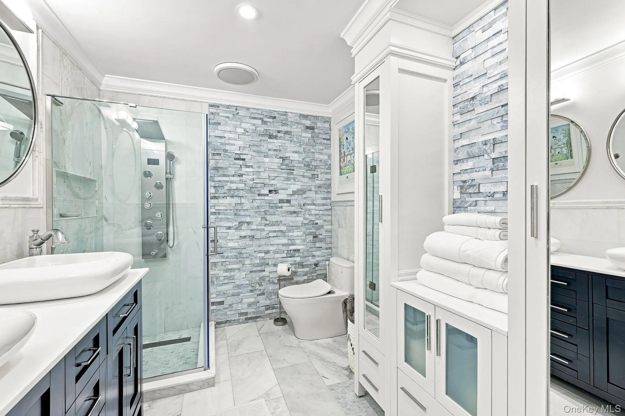 The shower stall had ultra-violet light from the main shower and body jets and there is the custom cabinetry for your linens and fine bath salts The shower stall had ultra-violet light from the main shower and body jets and there is the custom cabinetry for your linens and fine bath salts