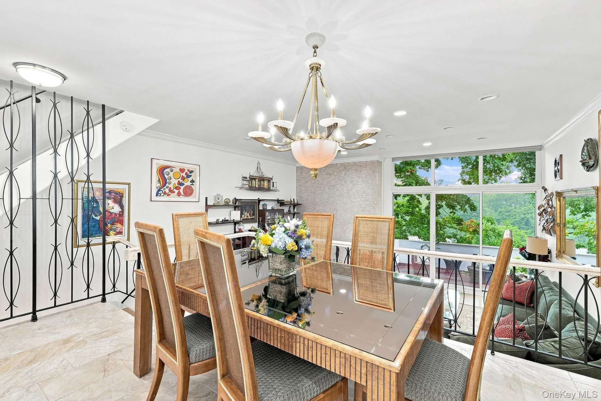 This formal dining room begins the open-concept living area with its Cream Marfil capped wrought iron railings This formal dining room begins the open-concept living area with its Cream Marfil capped wrought iron railings