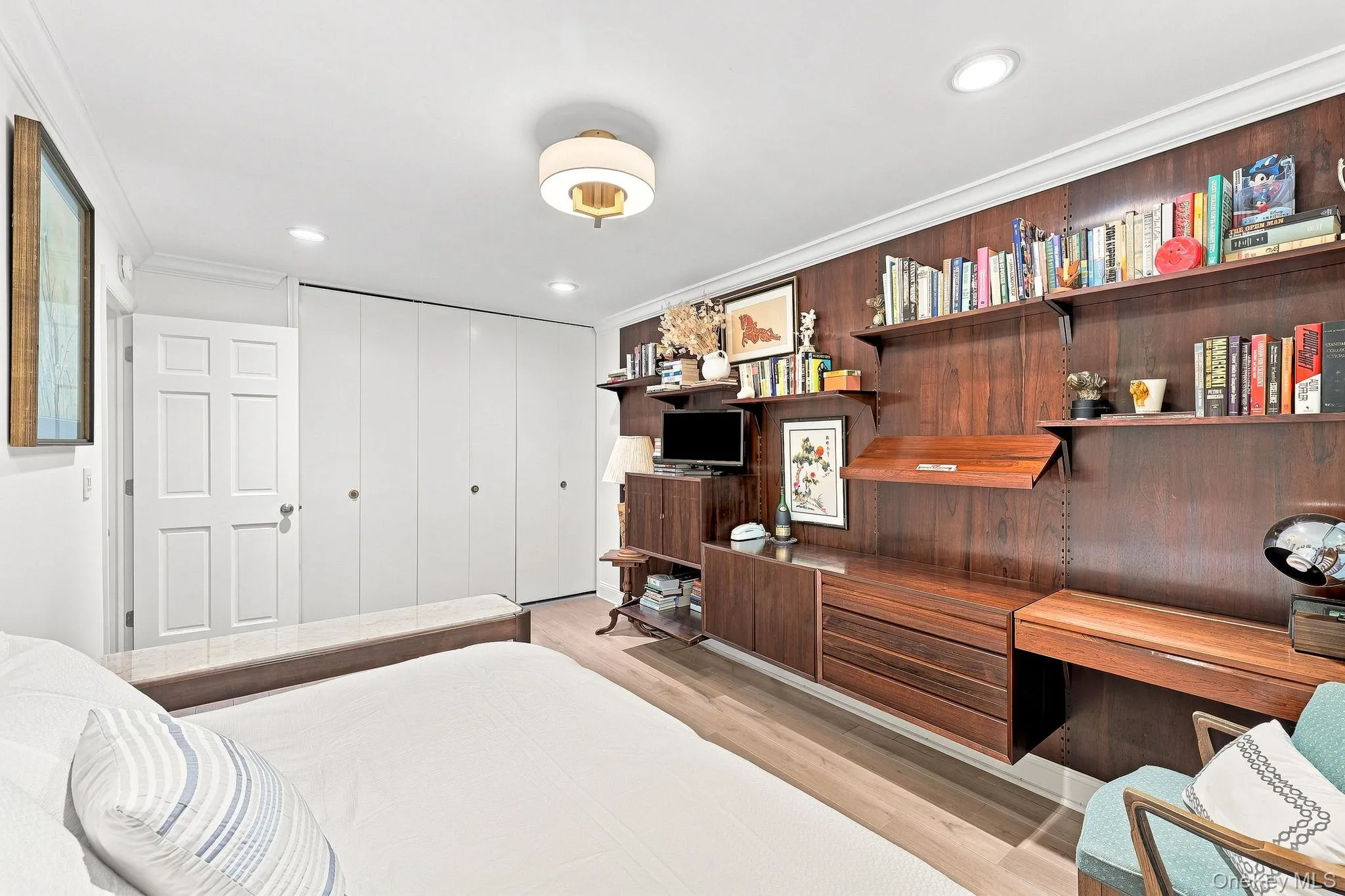 There is wood flooring, recessed lighting and a wall of California closets in this second bedroom There is wood flooring, recessed lighting and a wall of California closets in this second bedroom