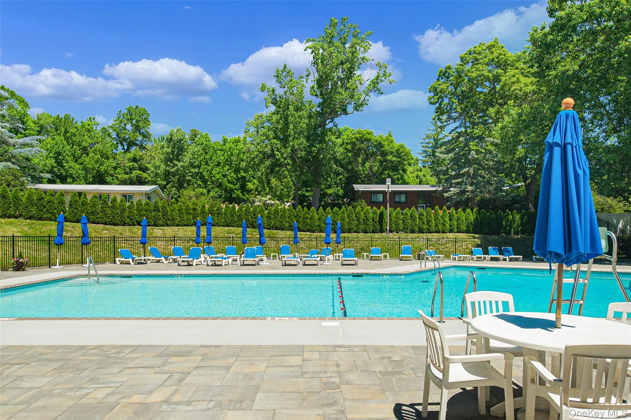 Enjoy summertime at the pool in lounge chairs or at the tables with seating and umbrellas, with Lifeguard on duty Enjoy summertime at the pool in lounge chairs or at the tables with seating and umbrellas, with Lifeguard on duty