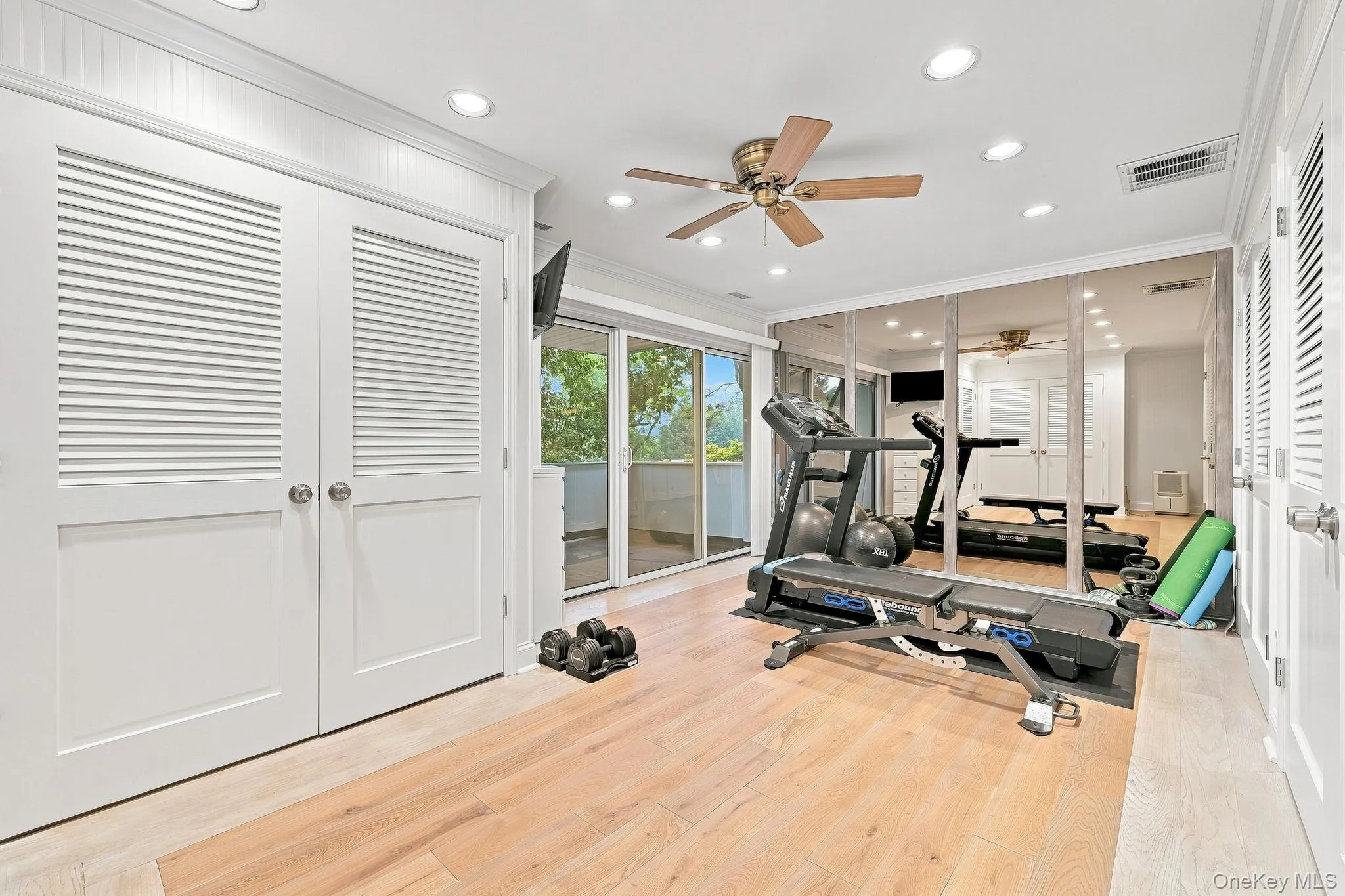 The lower level with beautiful inlaid flooring has 3 walls of custom storage closets that include 2 cedar closets, plus sliding glass doors to another re-built balcony that invites more fresh air in the Fall months The lower level with beautiful inlaid flooring has 3 walls of custom storage closets that include 2 cedar closets, plus sliding glass doors to another re-built balcony that invites more fresh air in the Fall months