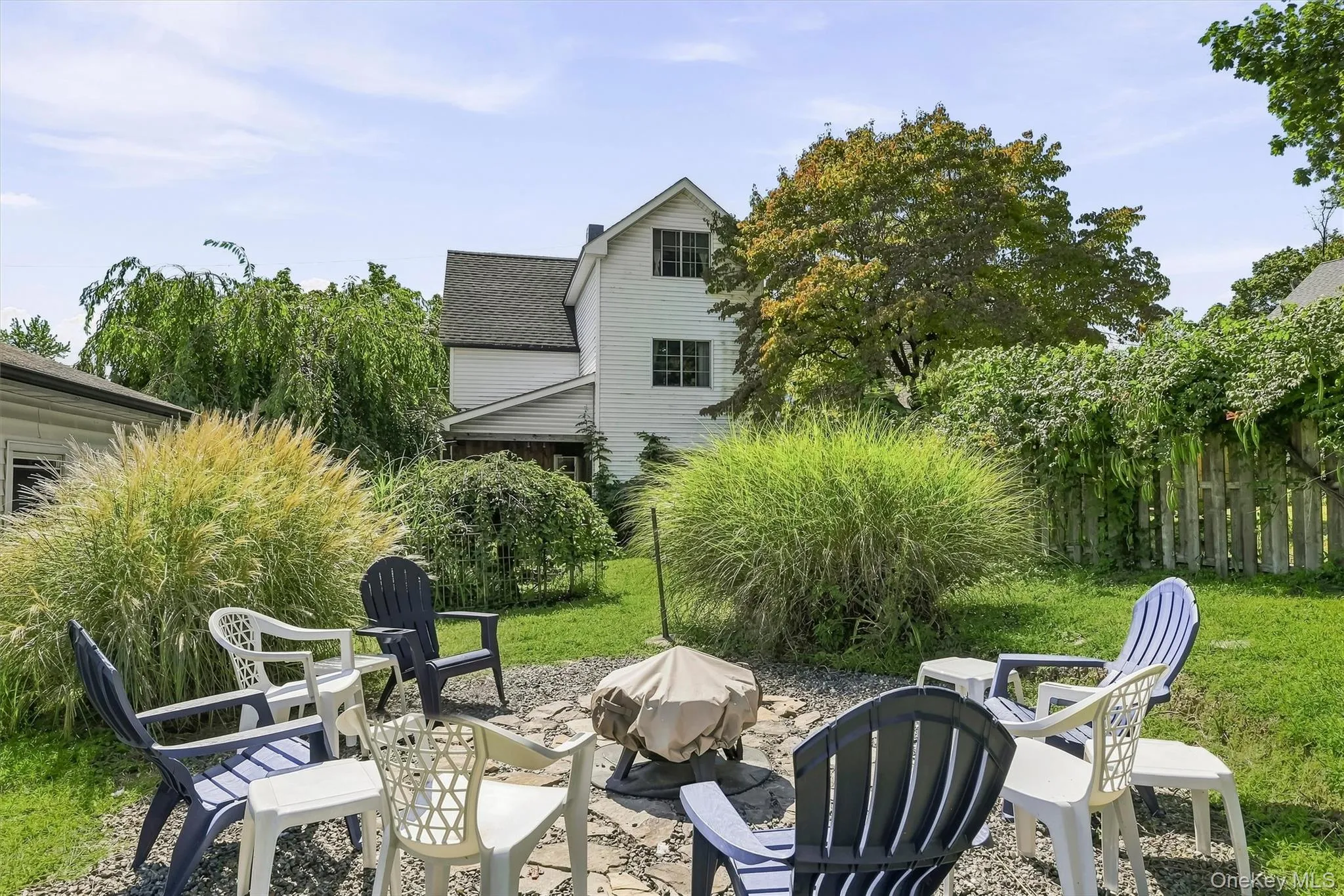 with firepit area in yard and Koi pond with firepit area in yard and Koi pond