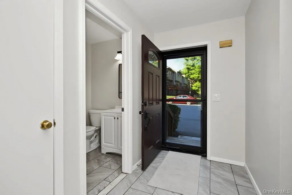Tiled Entry Foyer w/Powder Room adjacent Tiled Entry Foyer w/Powder Room adjacent