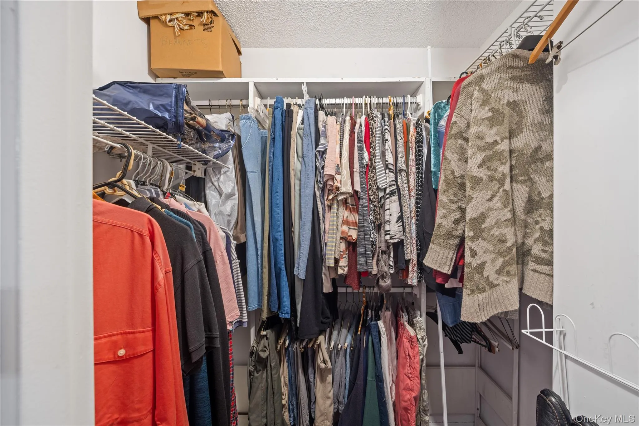 Built-in closet shelving system with multiple hanging rods Built-in closet shelving system with multiple hanging rods