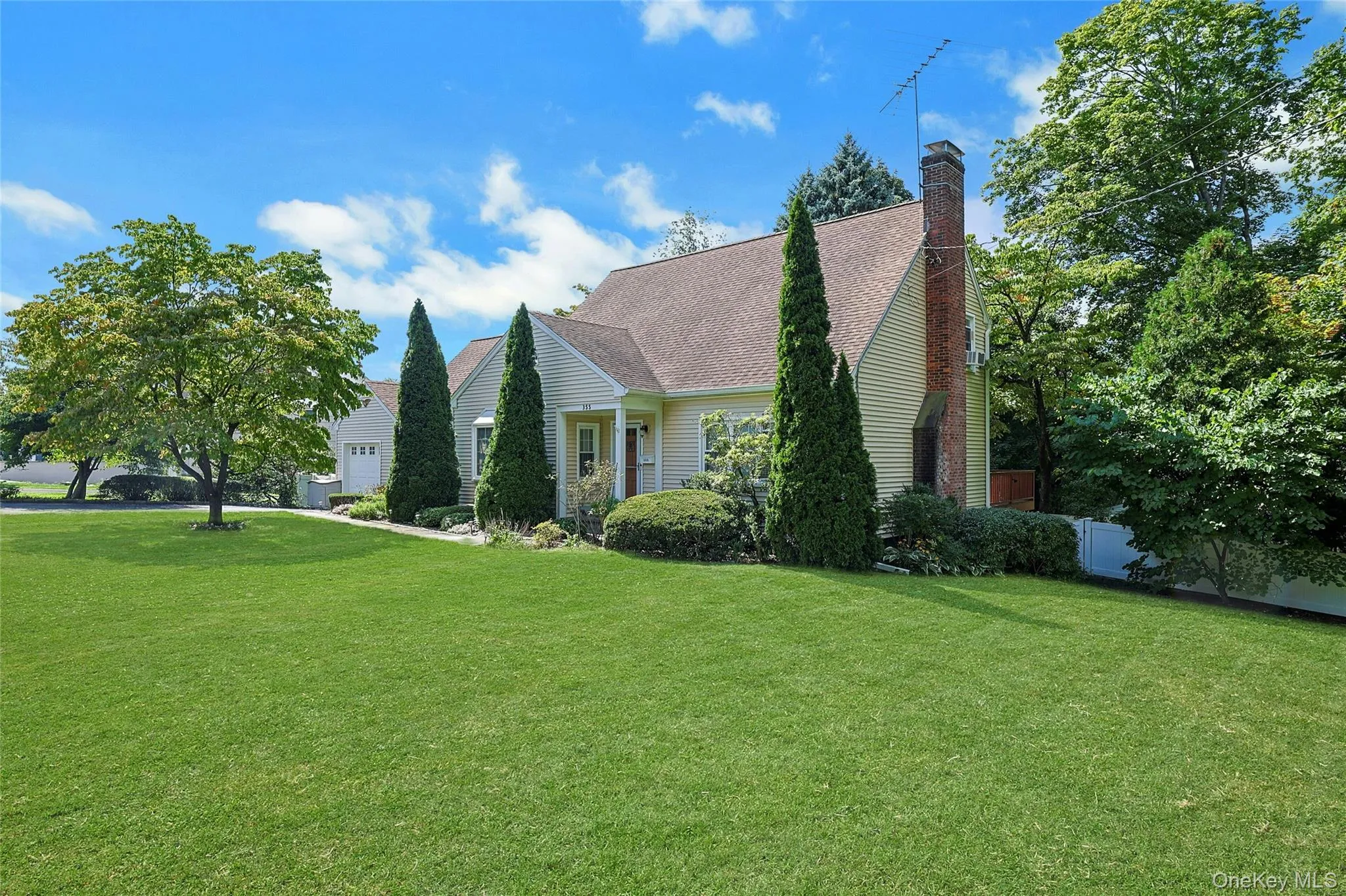 Lush Front Lawn and Mature Plantings on a 100x100 Corner Lot. Lush Front Lawn and Mature Plantings on a 100x100 Corner Lot.
