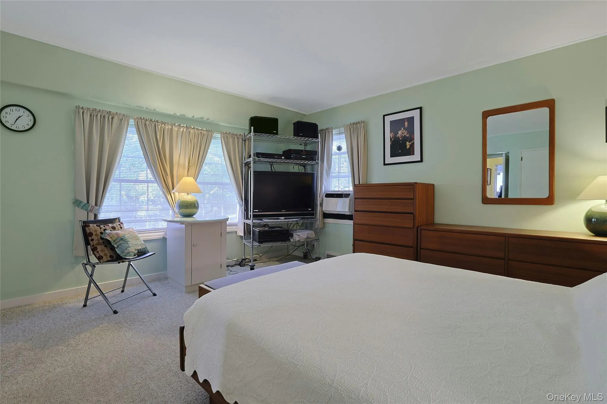Another view of the King Size Primary Bedroom featuring 3 windows for lots of natural light. Another view of the King Size Primary Bedroom featuring 3 windows for lots of natural light.
