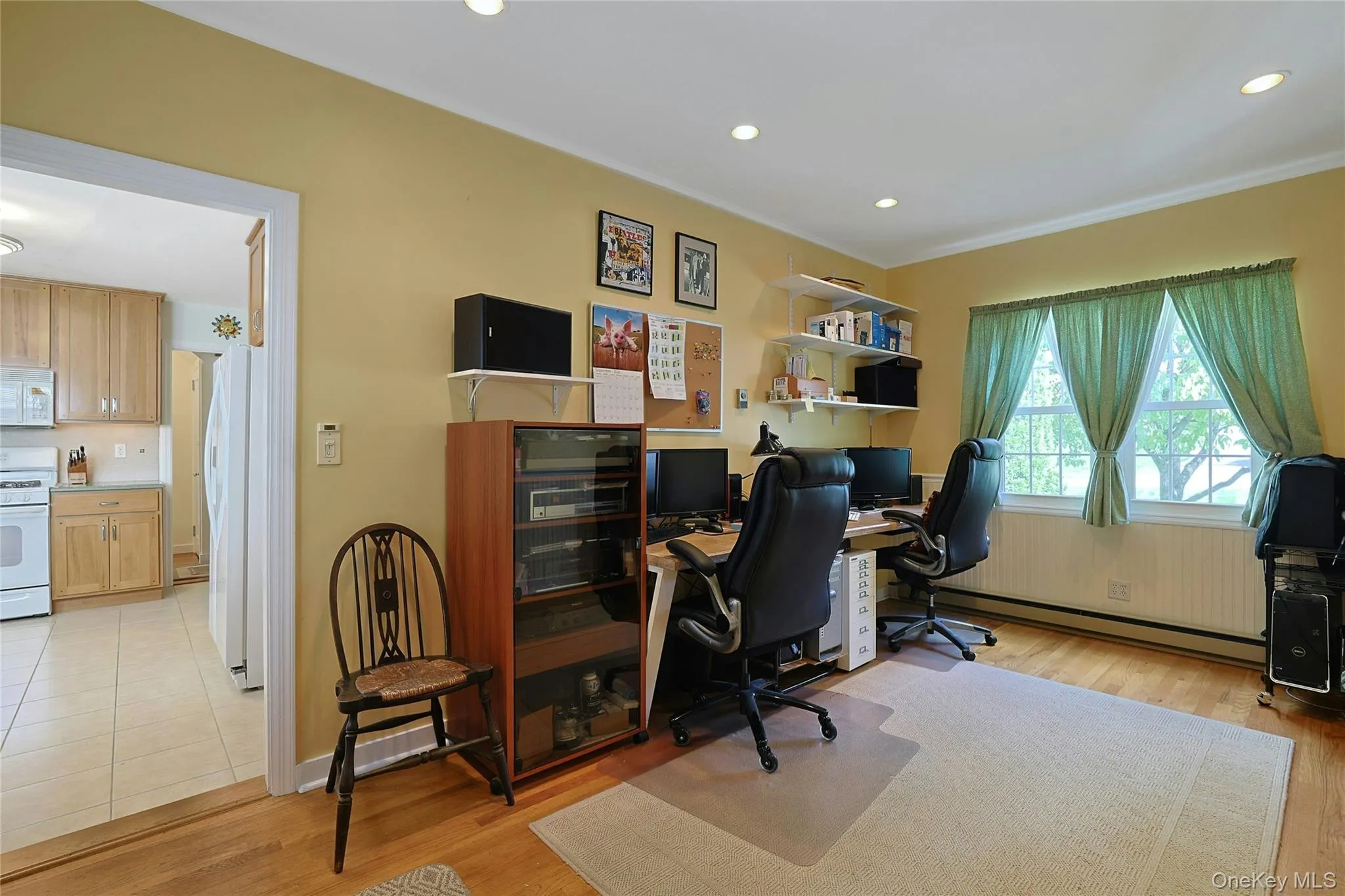 Den/Office featuring hardwood flooring, recessed lighting, double windows, and crown molding. This room can also be used as an extra sleeping space for family and guests. Den/Office featuring hardwood flooring, recessed lighting, double windows, and crown molding. This room can also be used as an extra sleeping space for family and guests.