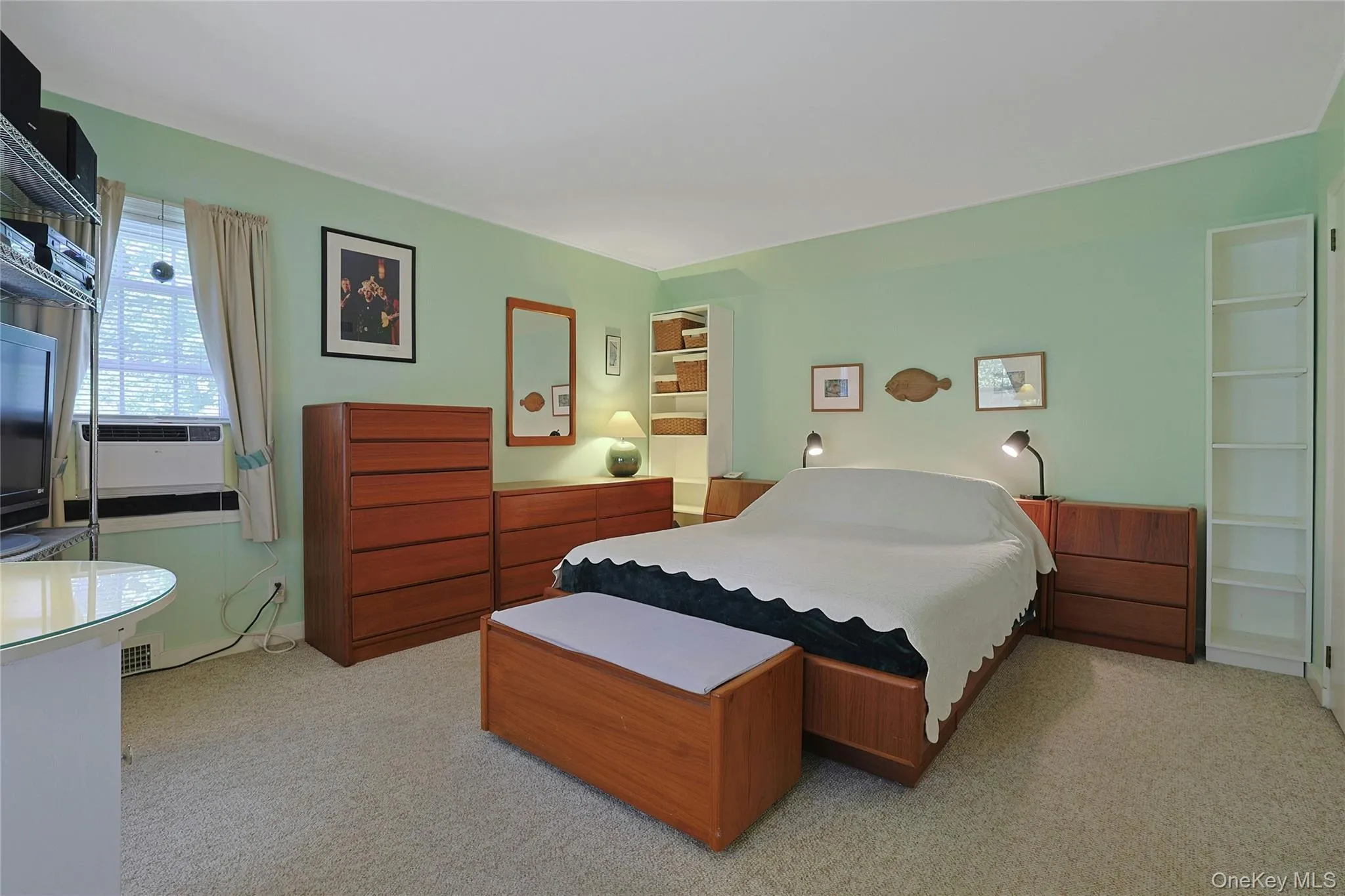Spacious Primary Bedroom with 2 Closets and wall to wall carpet over hardwood flooring. Spacious Primary Bedroom with 2 Closets and wall to wall carpet over hardwood flooring.
