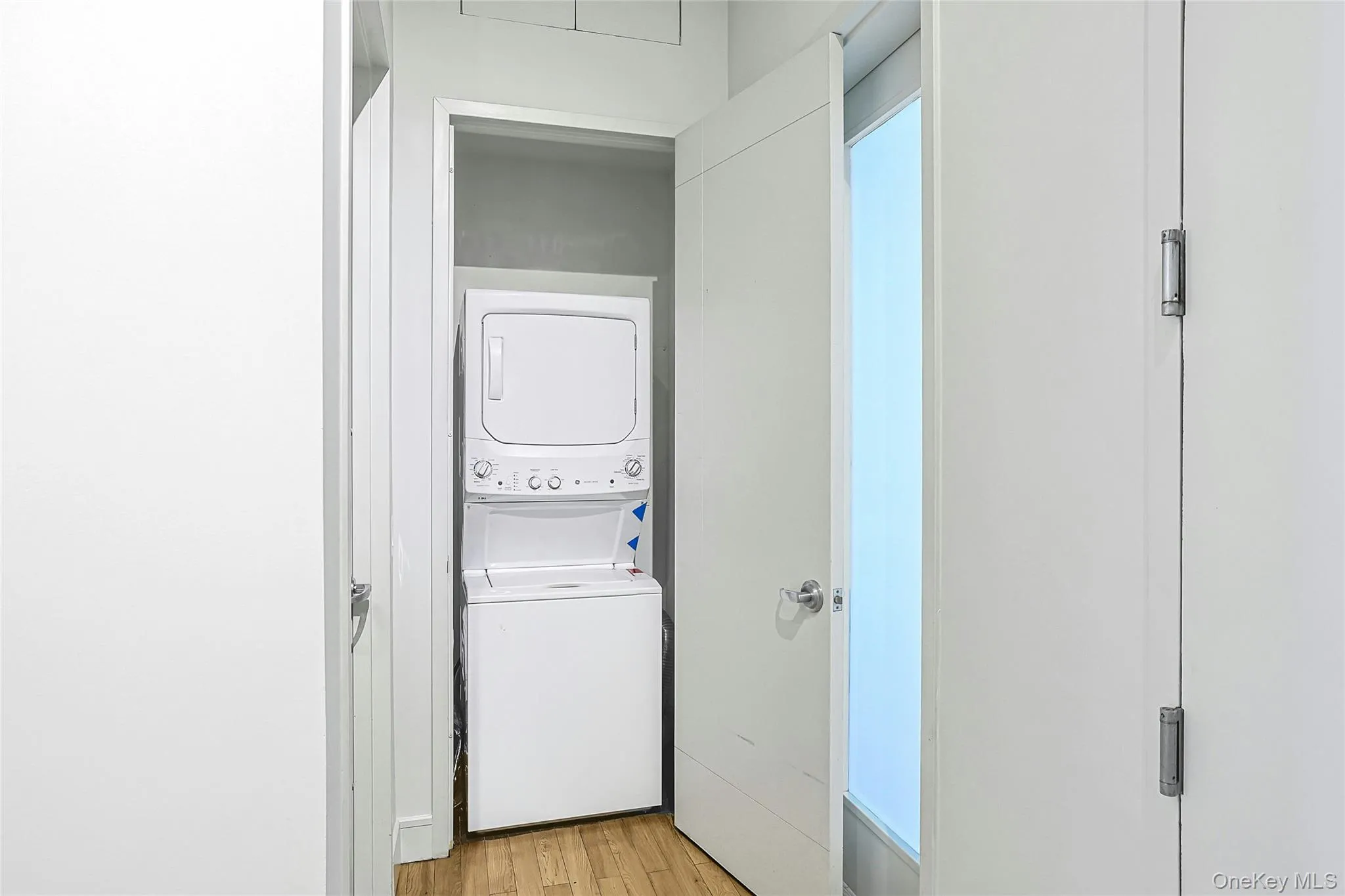 Convenient in-unit laundry with a stacked washer and dryer tucked into a dedicated closet. Convenient in-unit laundry with a stacked washer and dryer tucked into a dedicated closet.