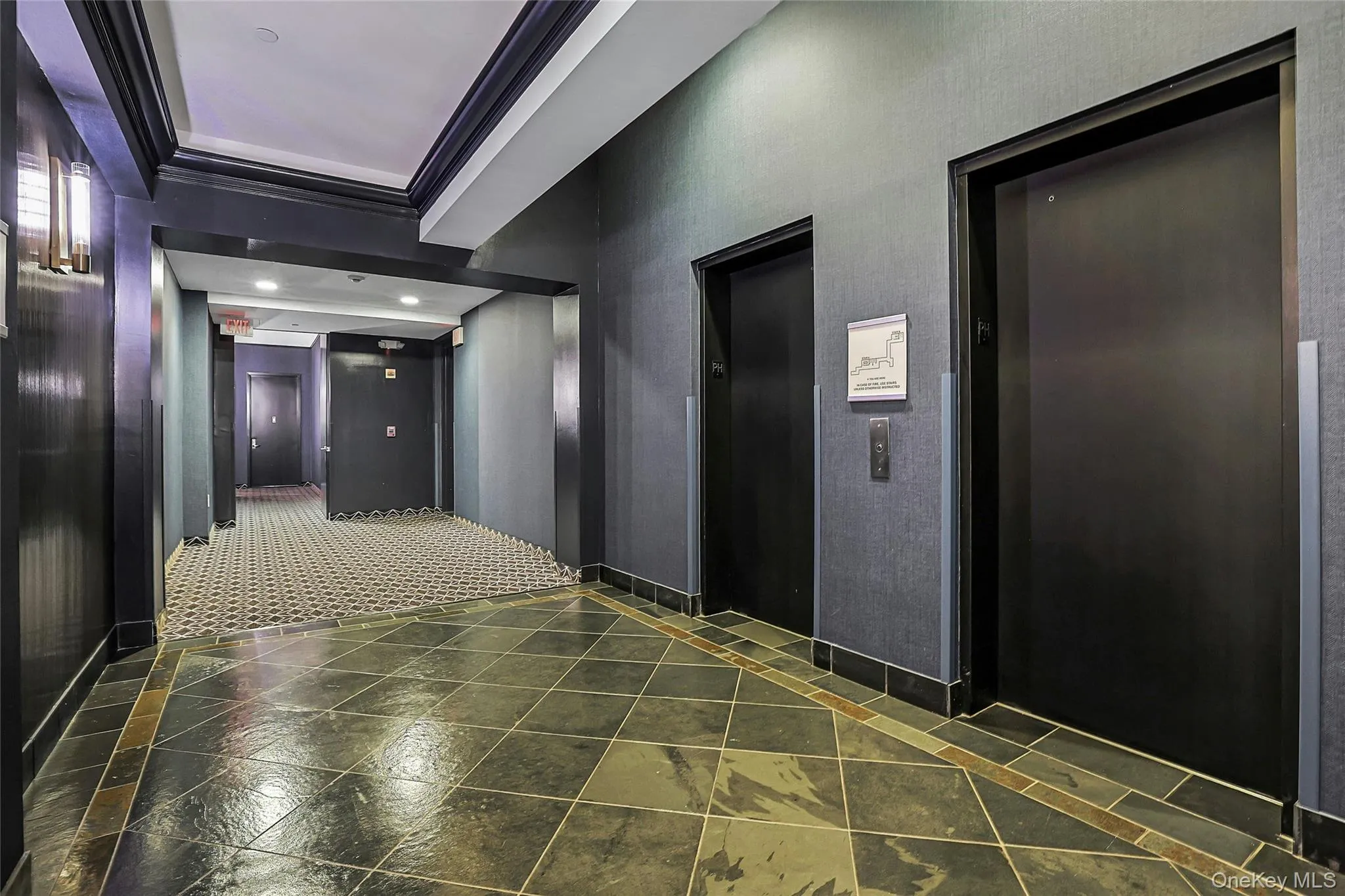 Stylish elevator lobby featuring modern finishes and tile flooring. Stylish elevator lobby featuring modern finishes and tile flooring.