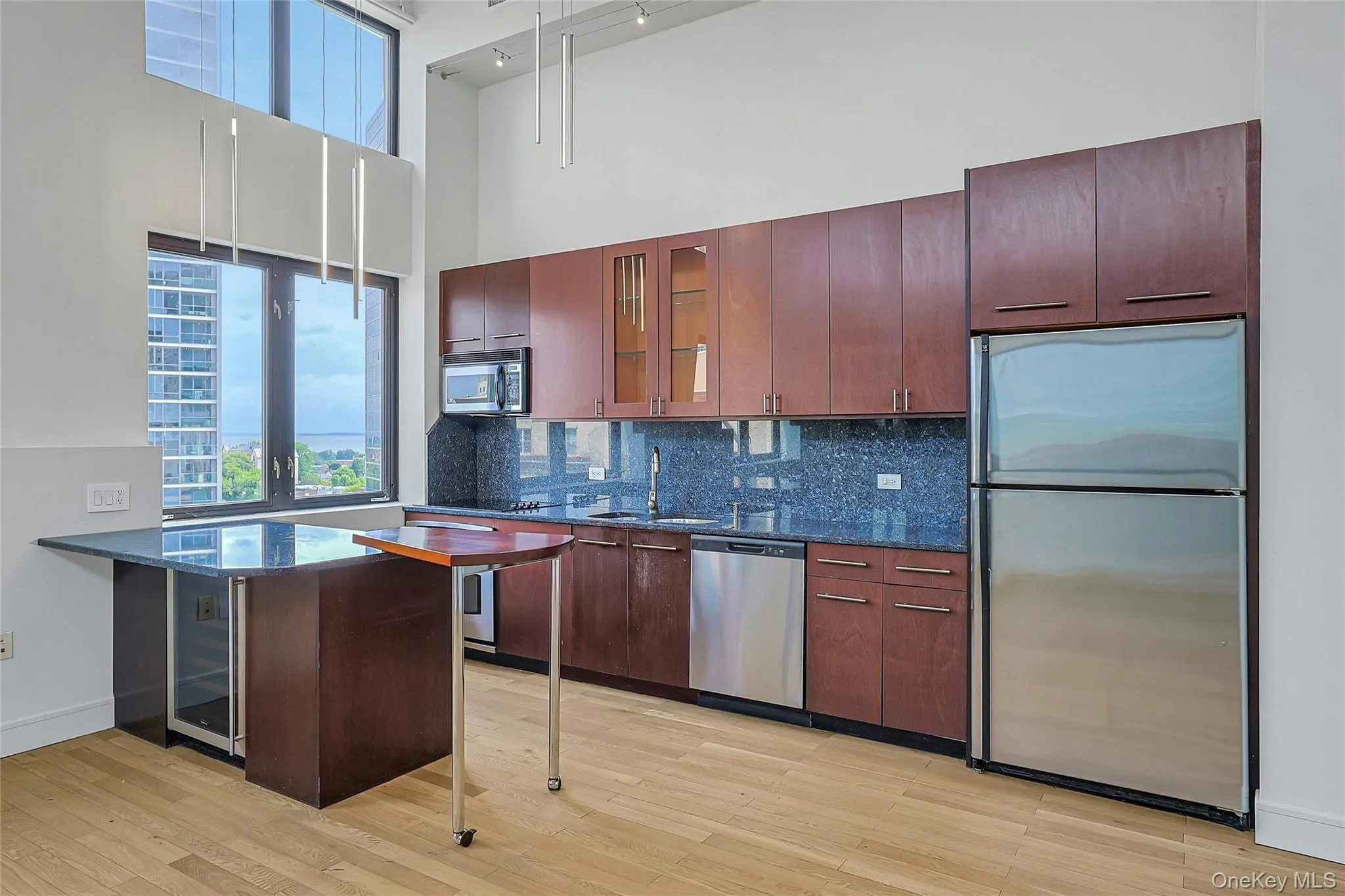 Spacious kitchen offering abundant cabinetry, generous counter space, and stainless steel appliances. Spacious kitchen offering abundant cabinetry, generous counter space, and stainless steel appliances.