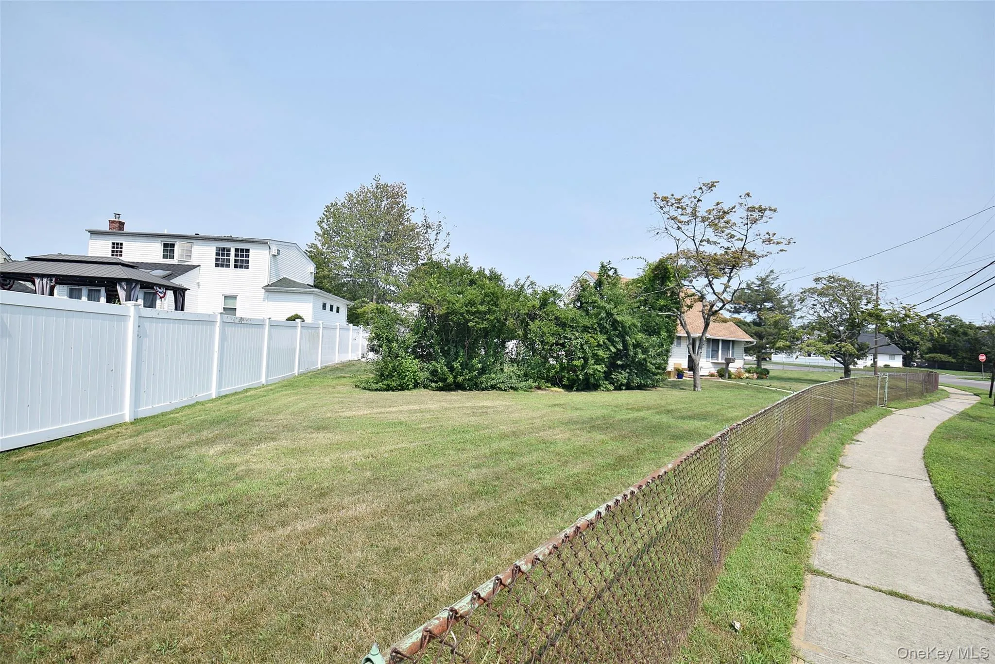 Sidewalk Leading to this Lovely Home; Privacy Hedges; PVC Fencing; Gated Property; Sidewalk Leading to this Lovely Home; Privacy Hedges; PVC Fencing; Gated Property;