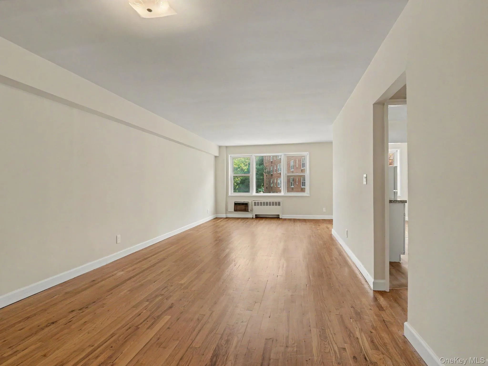 Huge open living space with beautiful hardwood floors. Huge open living space with beautiful hardwood floors.