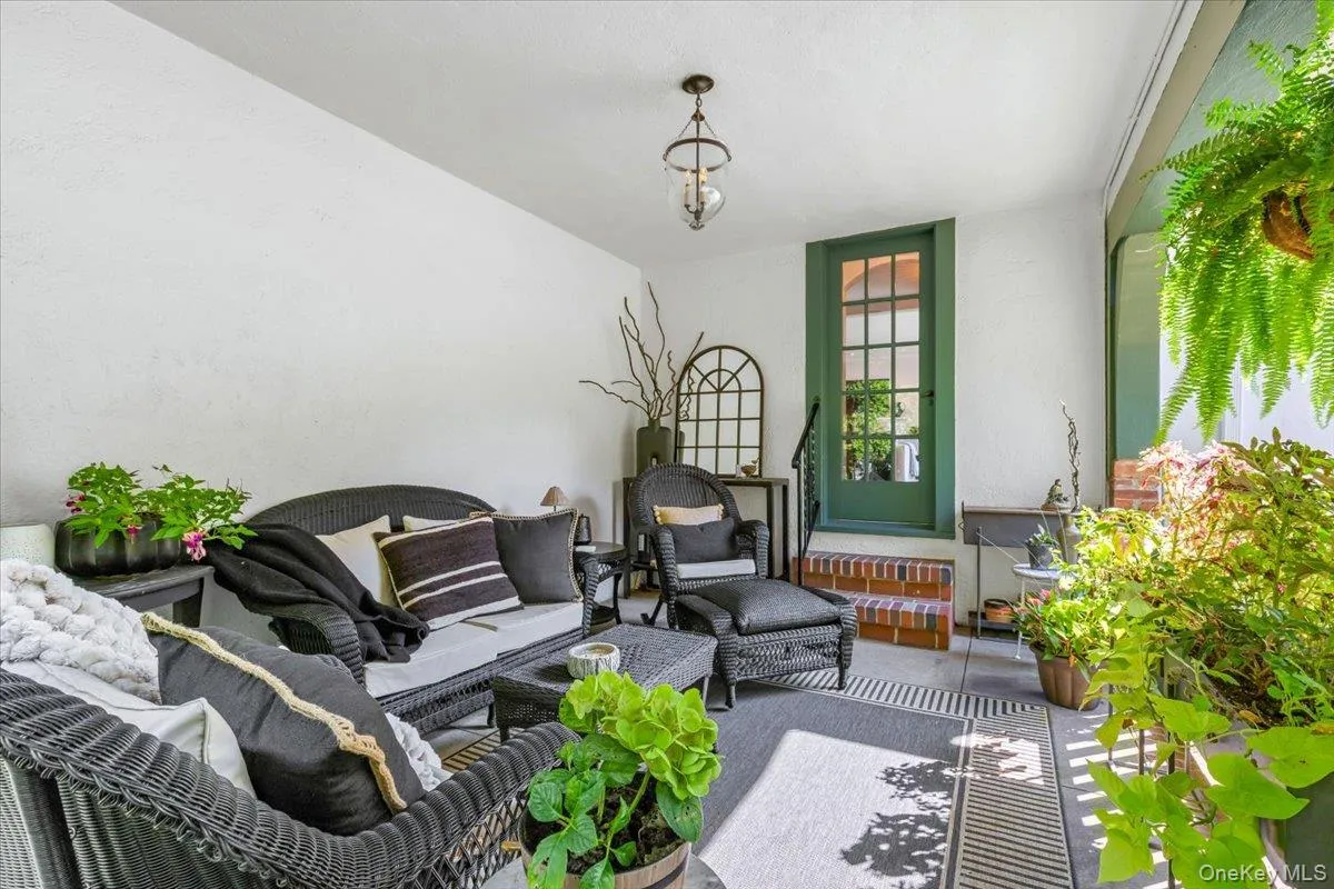 Covered porch offering a peaceful outdoor retreat Covered porch offering a peaceful outdoor retreat