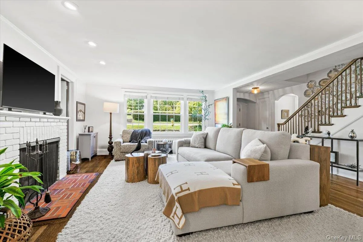 Living room with wood-burning fireplace and built-ins Living room with wood-burning fireplace and built-ins