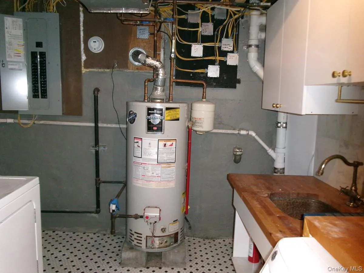 An upgraded electrical panel box is located in the Laundry Room. An upgraded electrical panel box is located in the Laundry Room.